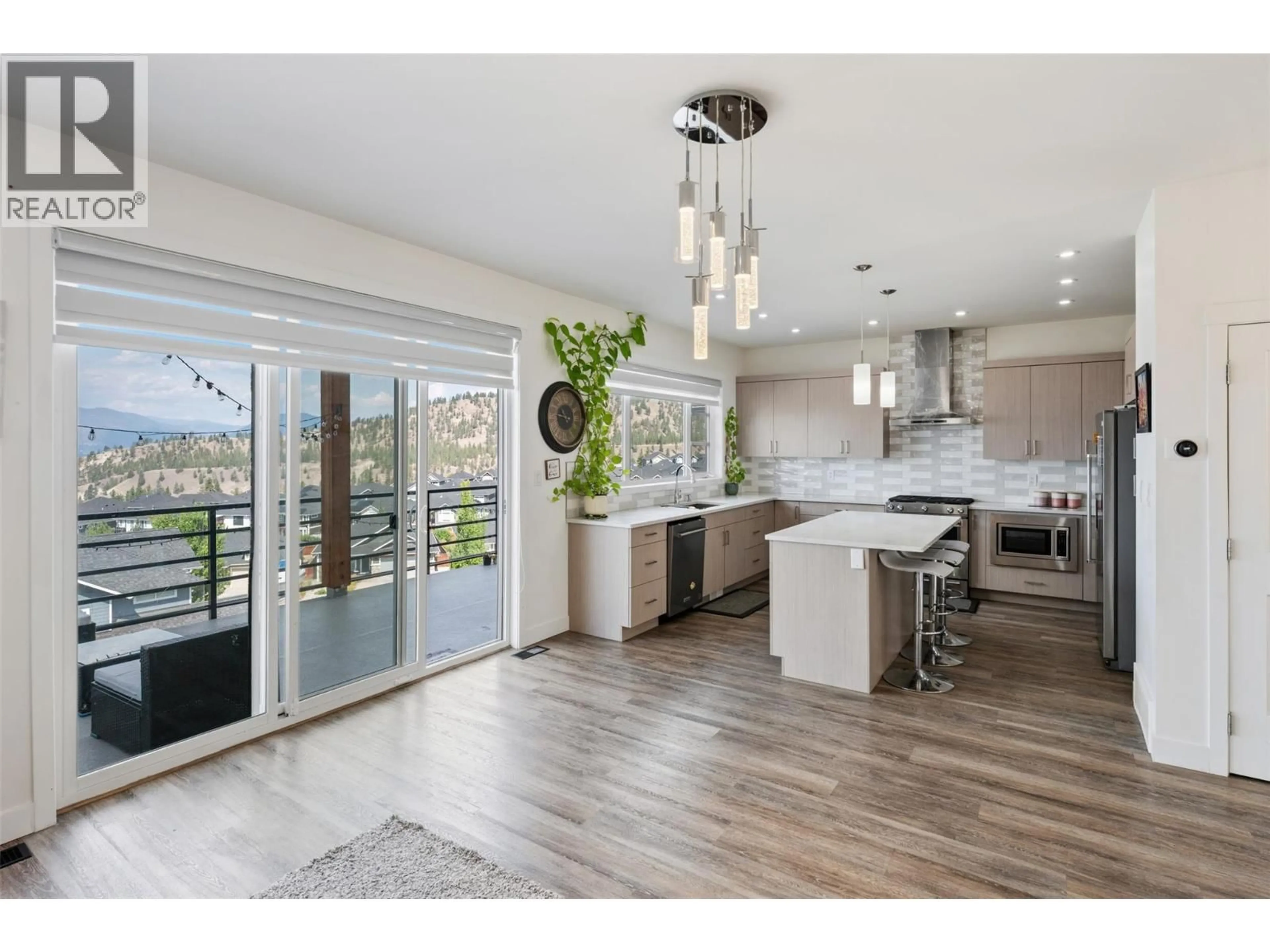 Open concept kitchen, wood/laminate floor for 1076 SYER ROAD, Penticton British Columbia V2A9G4