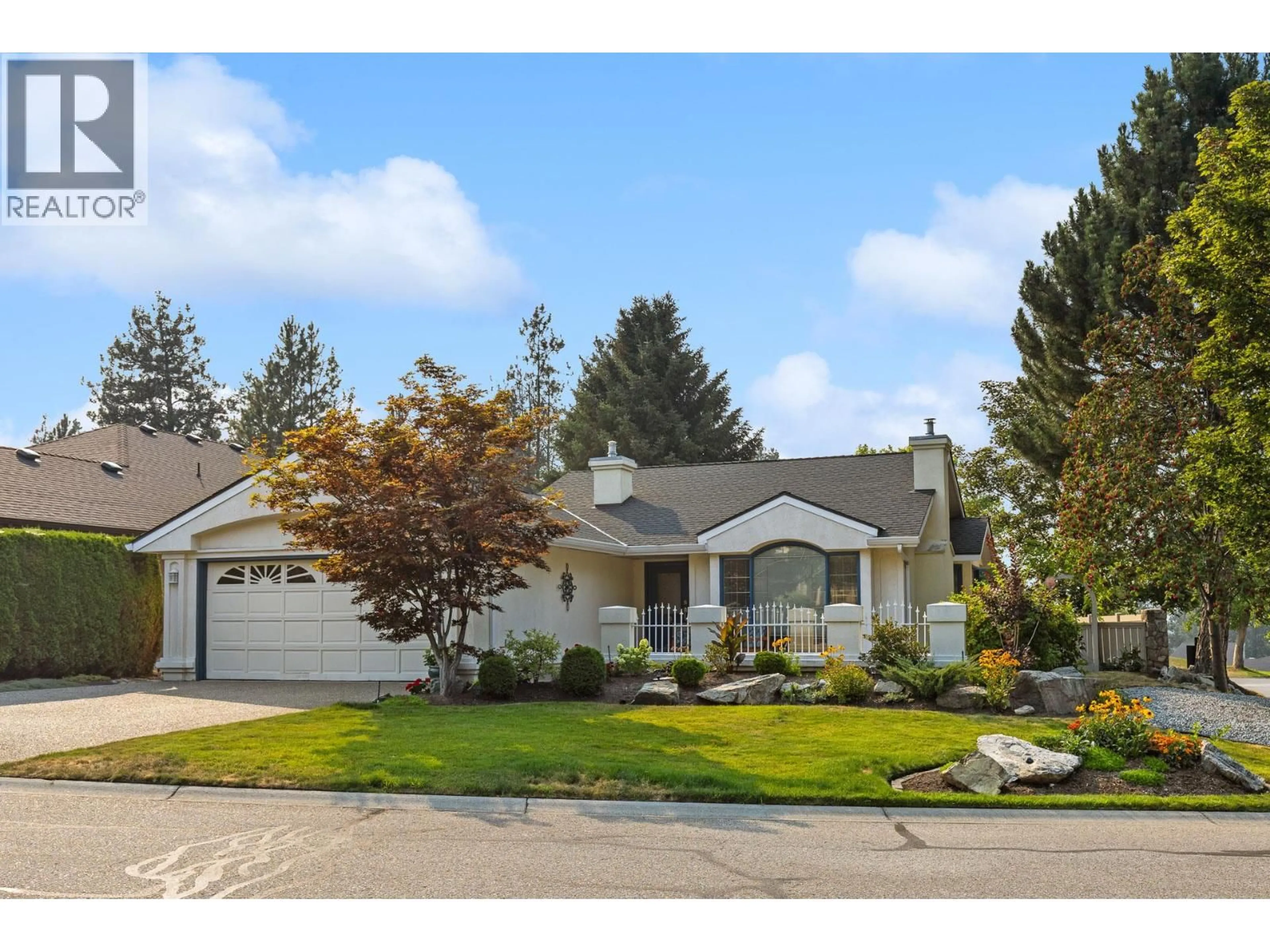 Home with vinyl exterior material, street for 4000 GALLAGHERS TERRACE, Kelowna British Columbia V1W3Z8