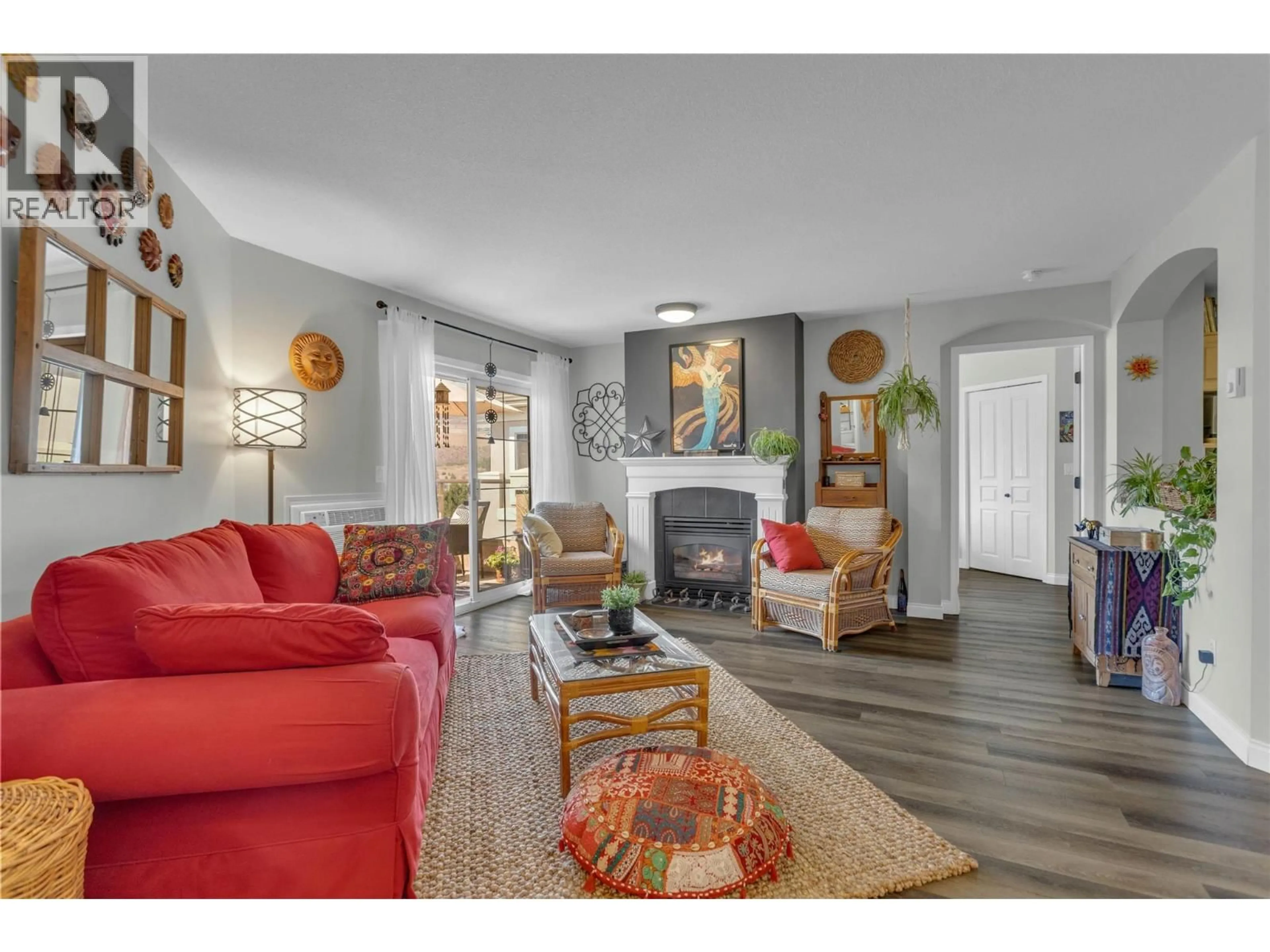Living room with furniture, wood/laminate floor for 314 - 3880 BROWN ROAD, West Kelowna British Columbia V4T2J5