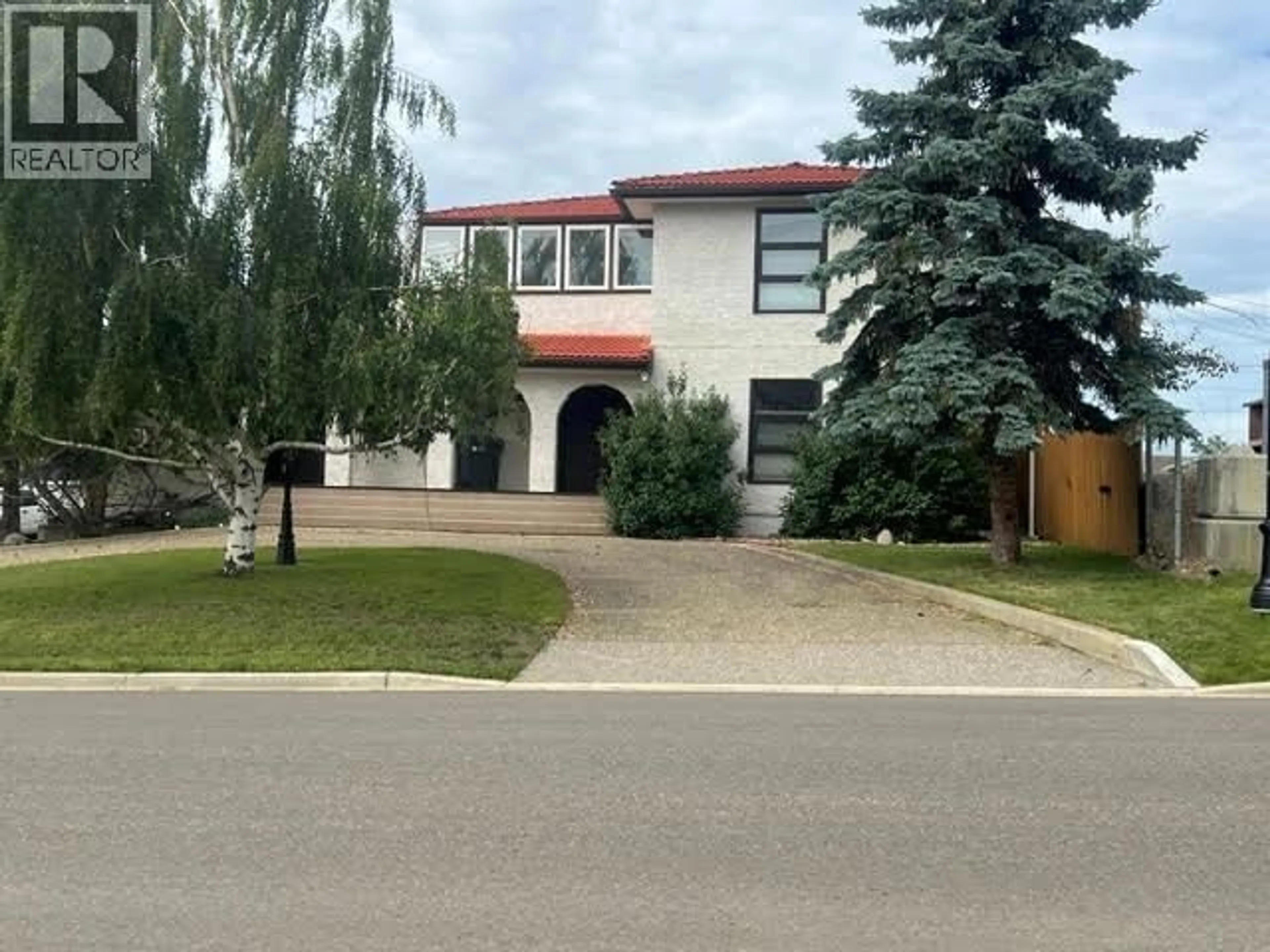 A pic from outside/outdoor area/front of a property/back of a property/a pic from drone, street for 808 96 AVENUE, Dawson Creek British Columbia V1G1K7