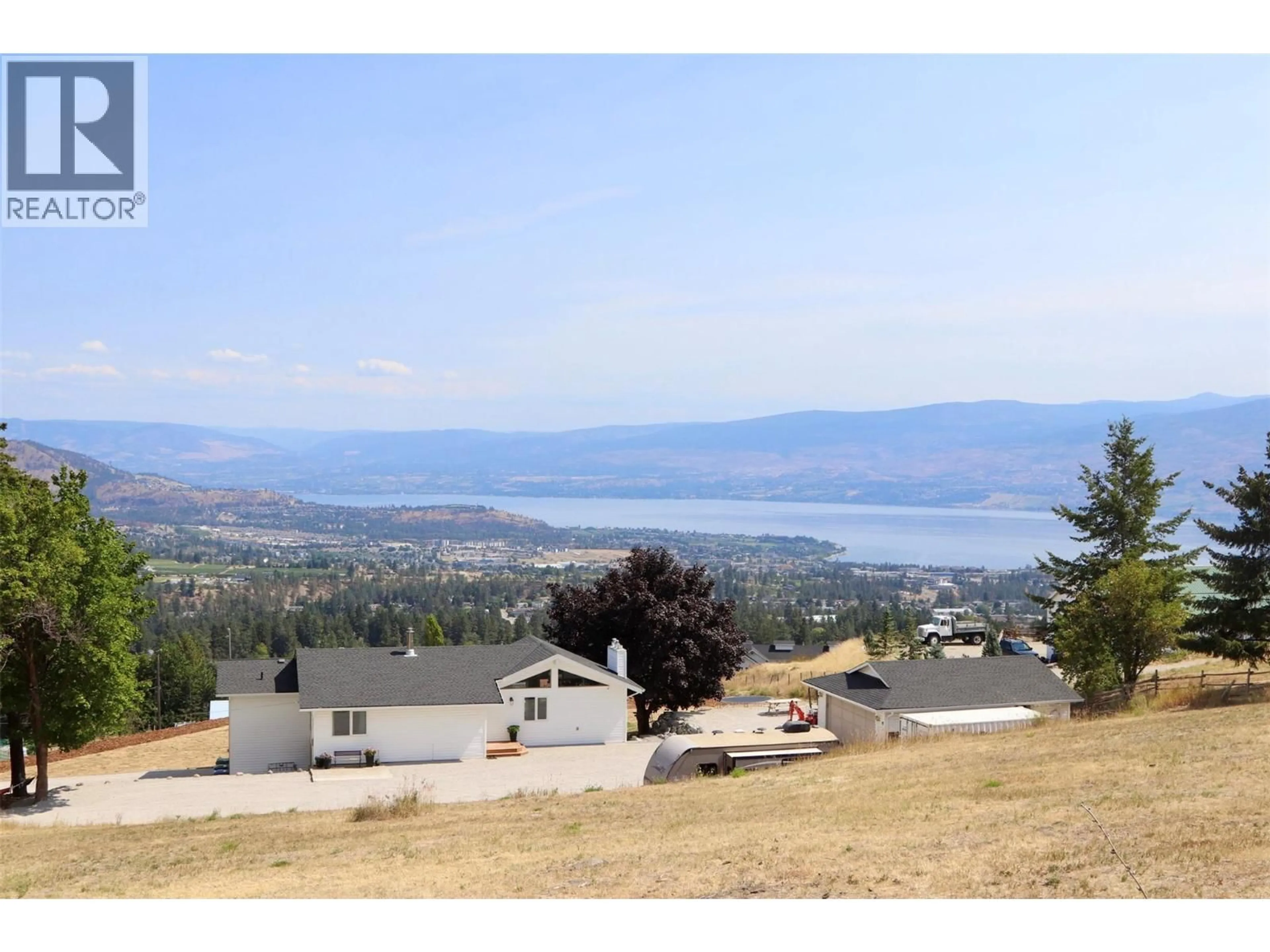 A pic from outside/outdoor area/front of a property/back of a property/a pic from drone, water/lake/river/ocean view for 3491 FENTON ROAD, West Kelowna British Columbia V4T1V8