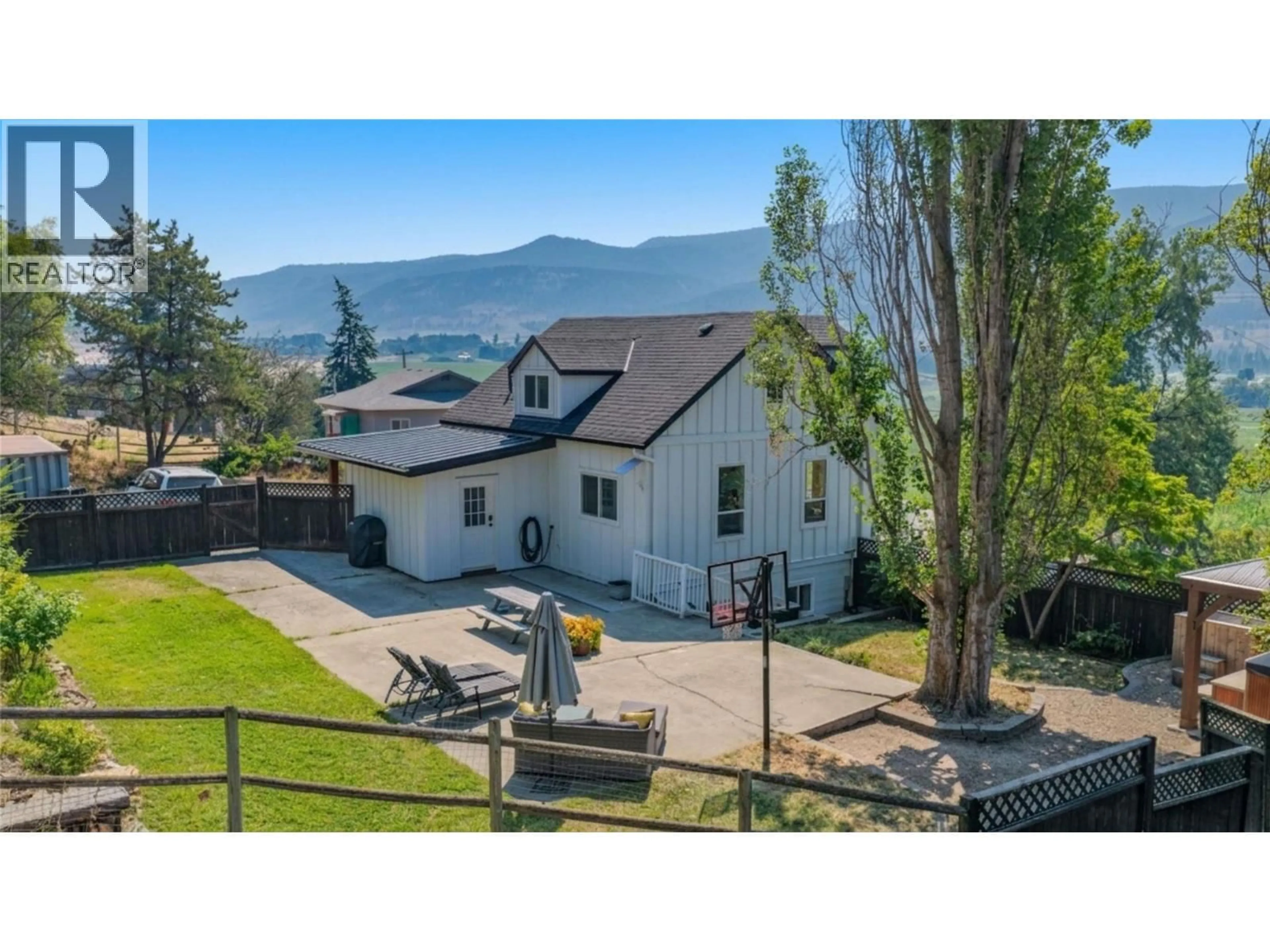 A pic from outside/outdoor area/front of a property/back of a property/a pic from drone, mountain view for 9211 6 HIGHWAY, Coldstream British Columbia V1B3B5