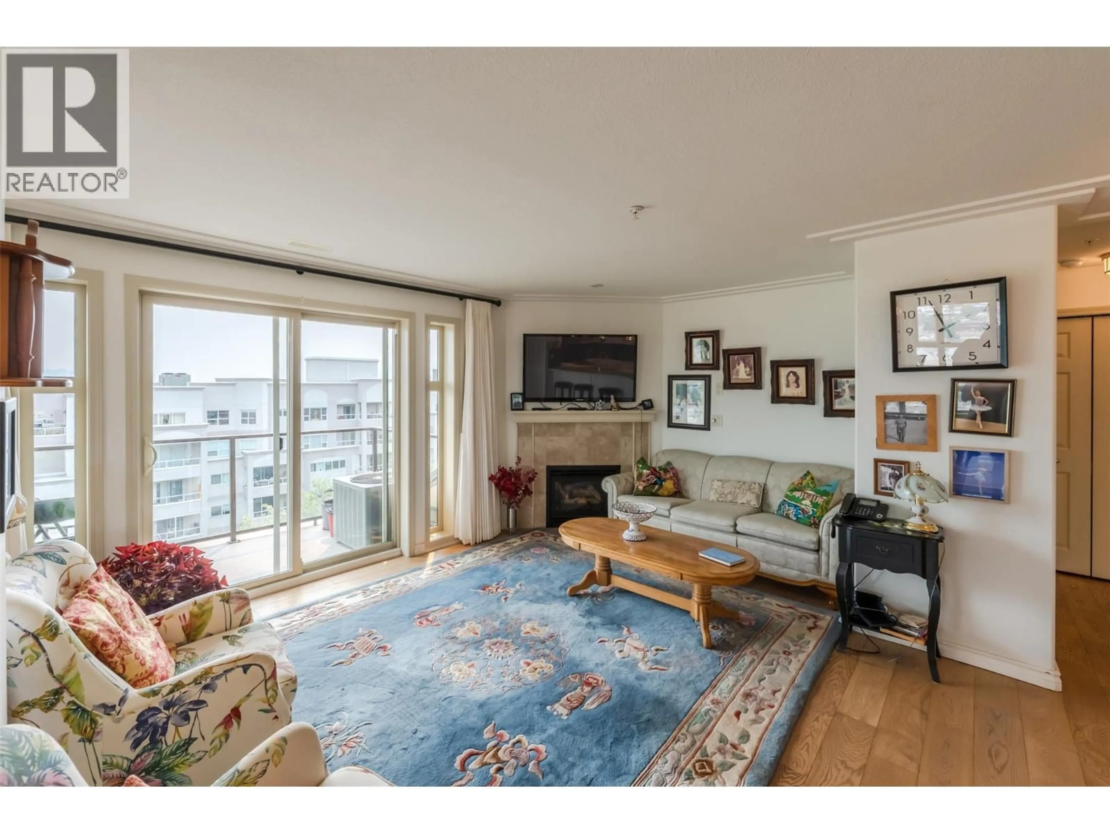 Living room with furniture, wood/laminate floor for 901 - 2125 ATKINSON STREET, Penticton British Columbia V2A9E6