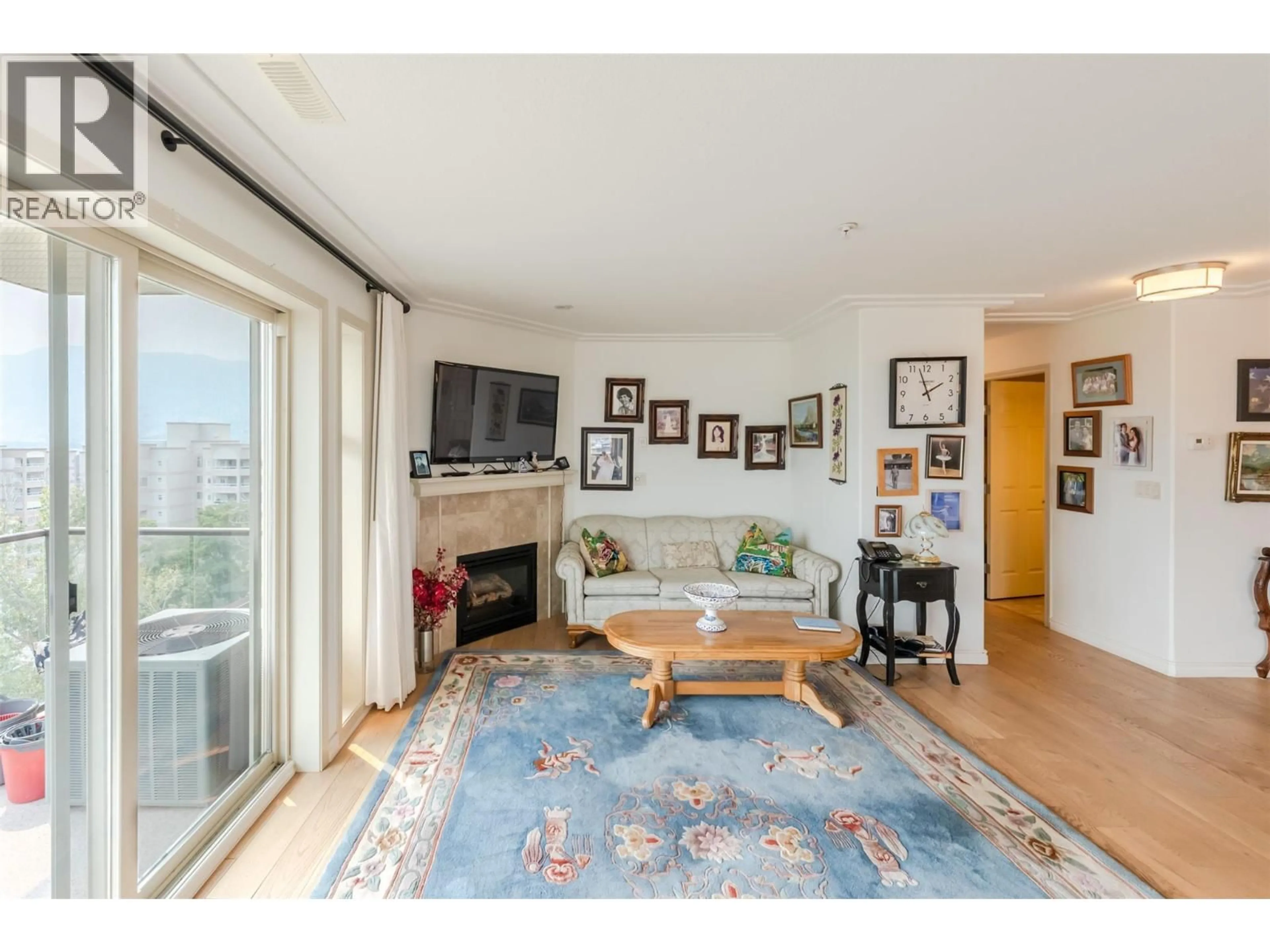 Living room with furniture, wood/laminate floor for 901 - 2125 ATKINSON STREET, Penticton British Columbia V2A9E6