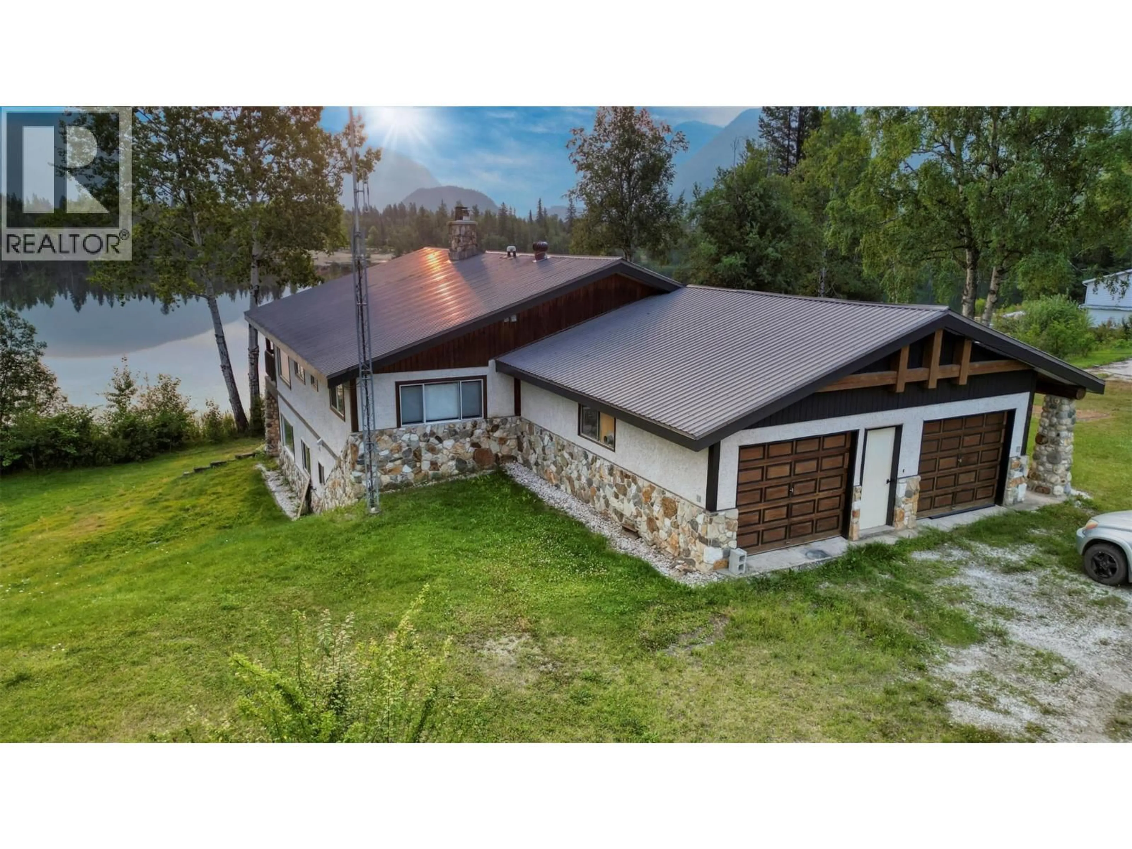 A pic from outside/outdoor area/front of a property/back of a property/a pic from drone, water/lake/river/ocean view for 906 HARRWOOD DRIVE, Blue River British Columbia V0E1J0