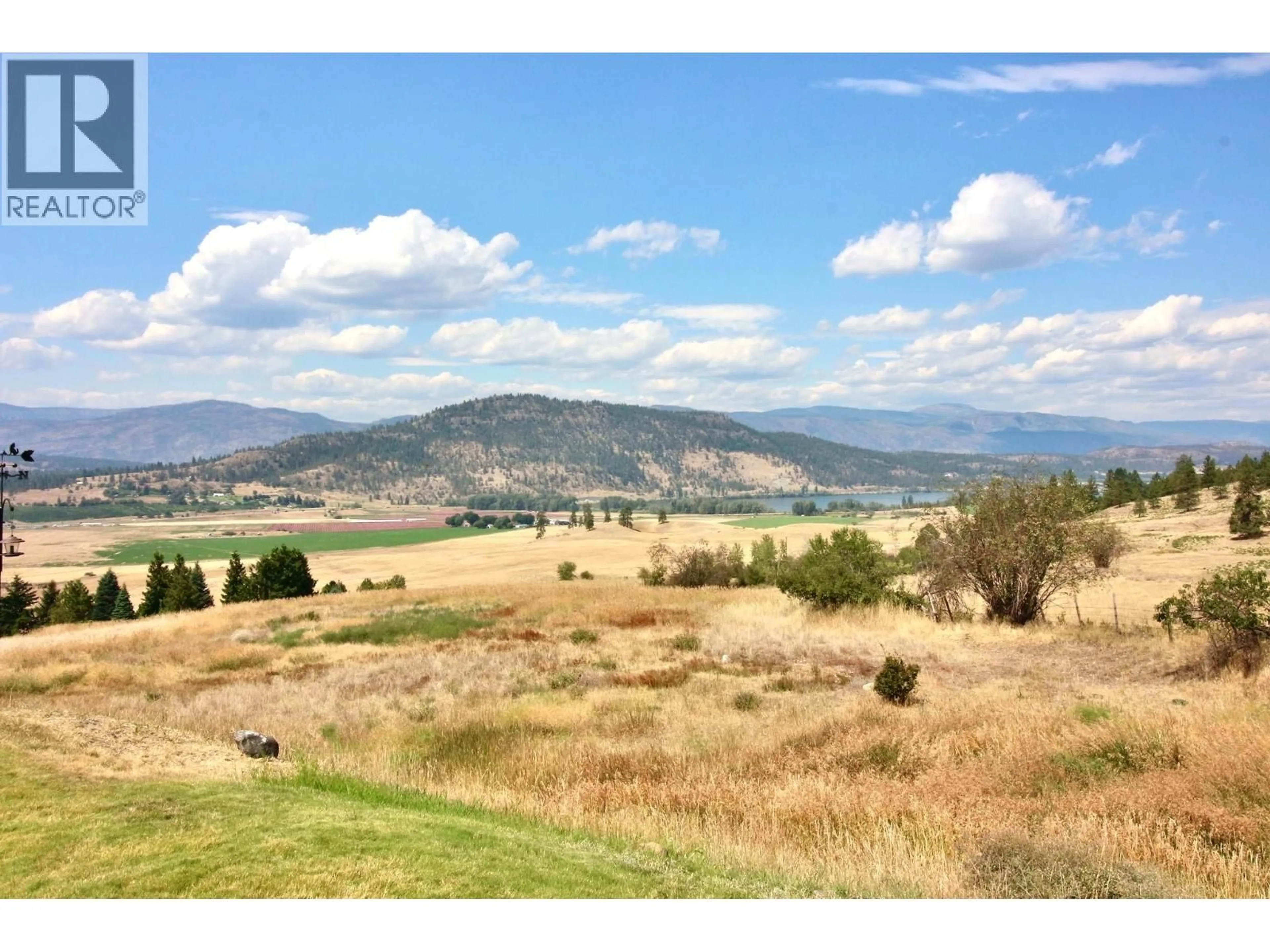 A pic from outside/outdoor area/front of a property/back of a property/a pic from drone, mountain view for 66 - 6400 SPENCER ROAD, Kelowna British Columbia V1X7T6