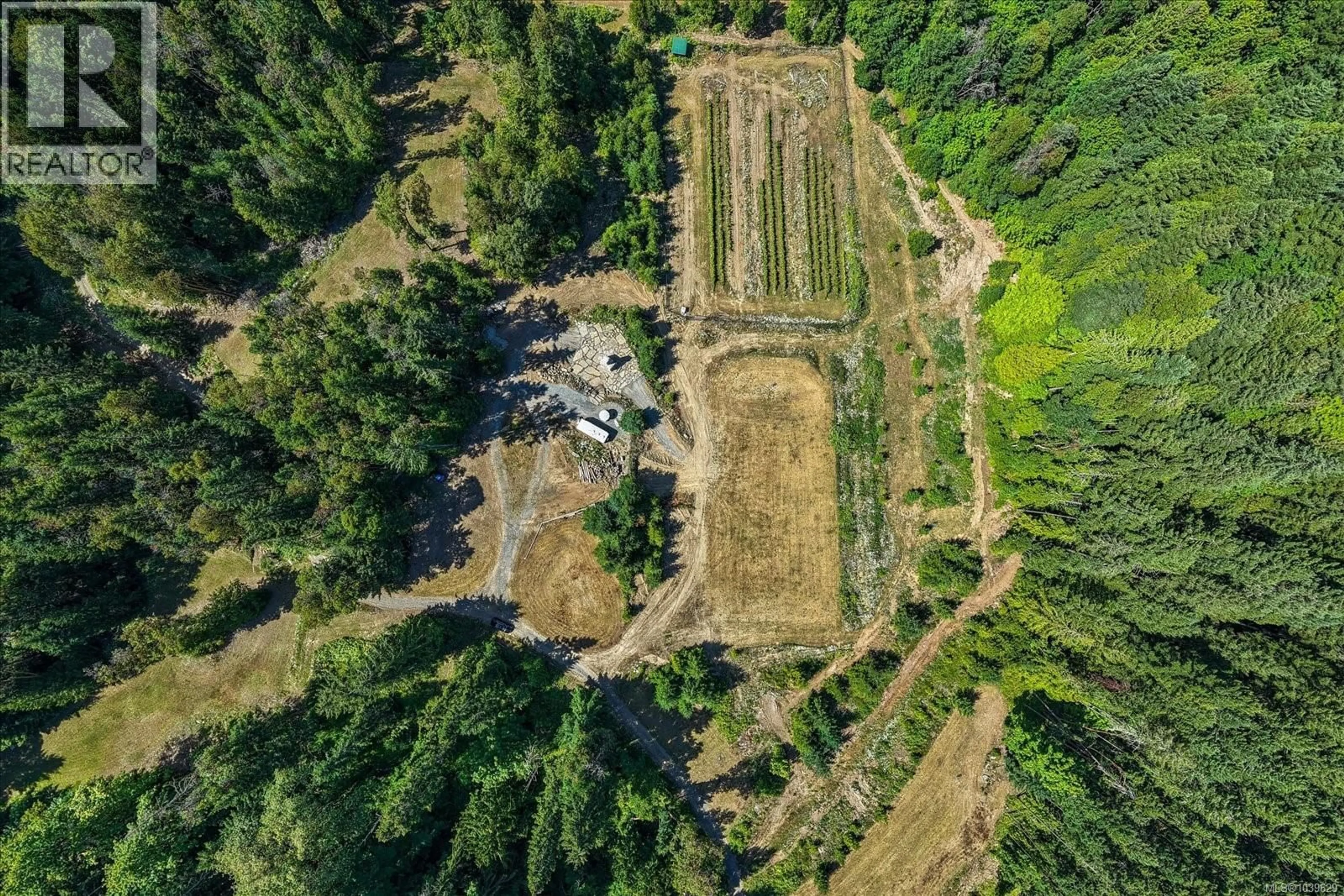 A pic from outside/outdoor area/front of a property/back of a property/a pic from drone, forest/trees view for 13520 ROUNDUP DRIVE, Ladysmith British Columbia V9G1H4