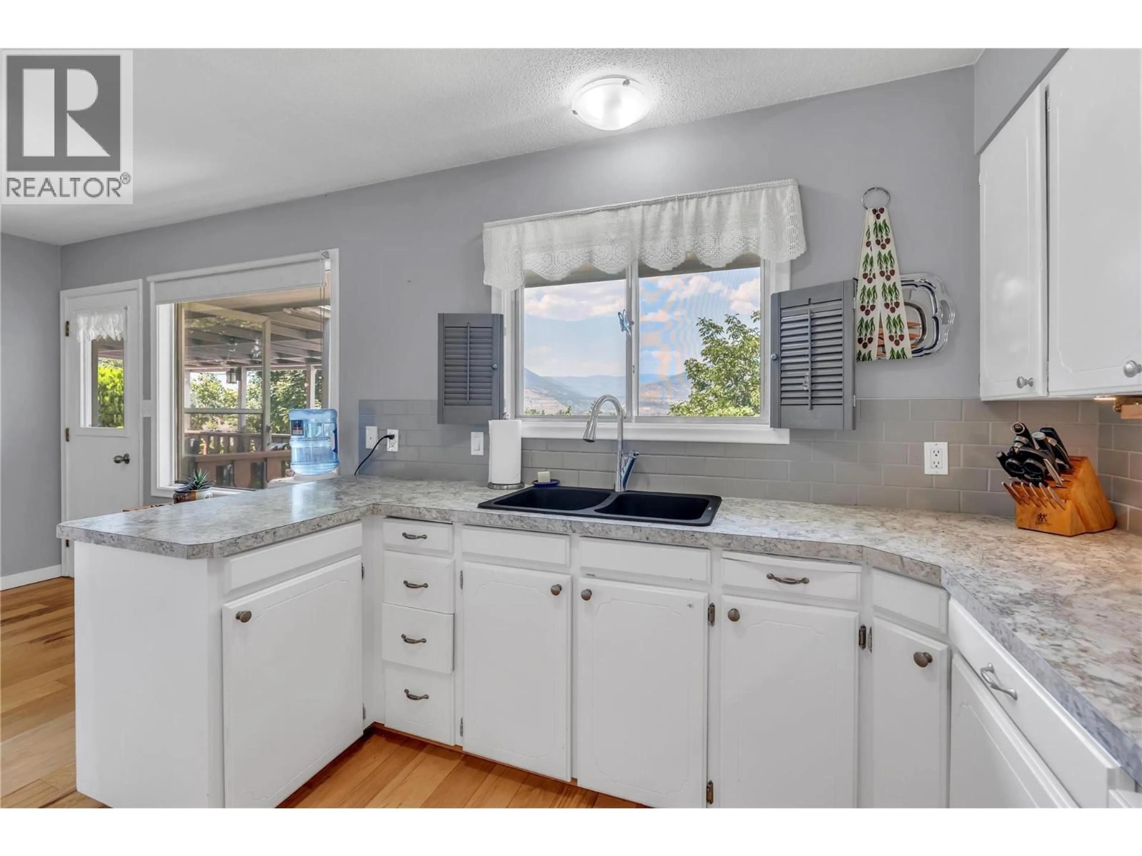 Open concept kitchen, ceramic/tile floor for 707 ROSS AVENUE, Penticton British Columbia V2A3A5