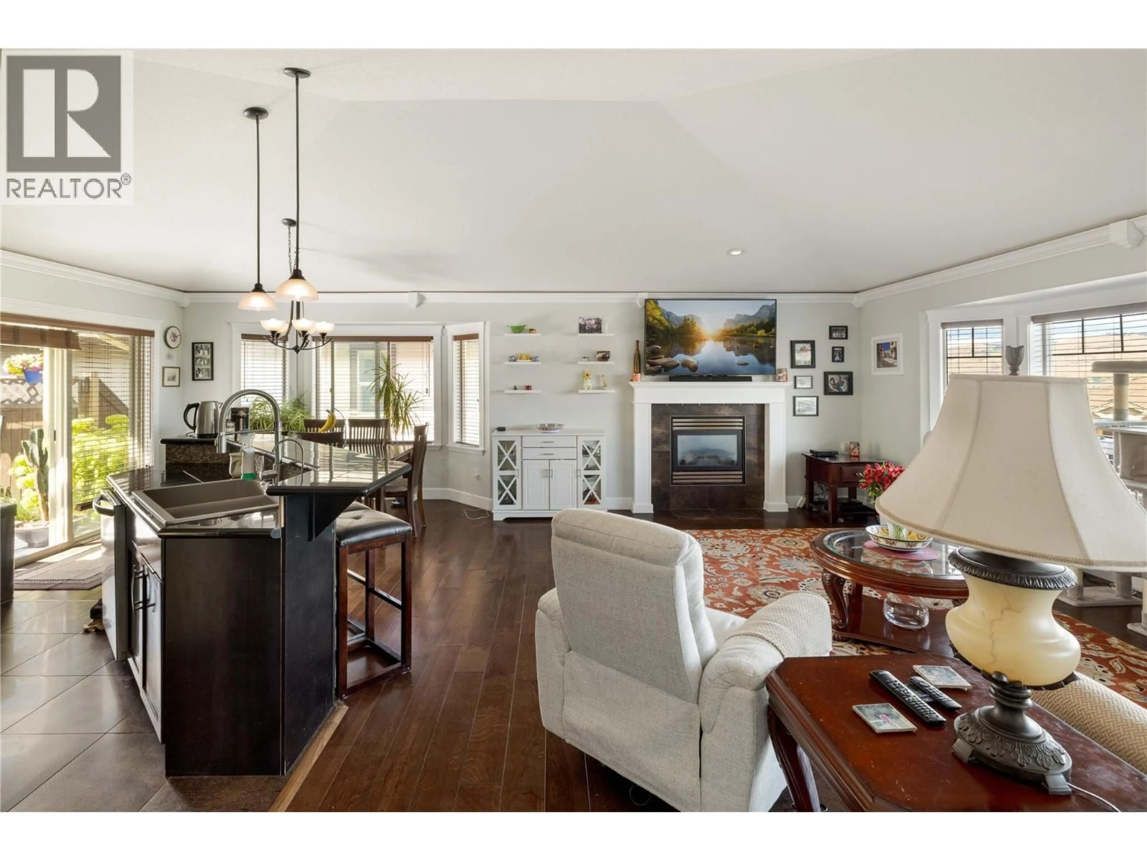 Open concept kitchen, wood/laminate floor for 927 MT. GRADY CLOSE, Vernon British Columbia V1B4B6