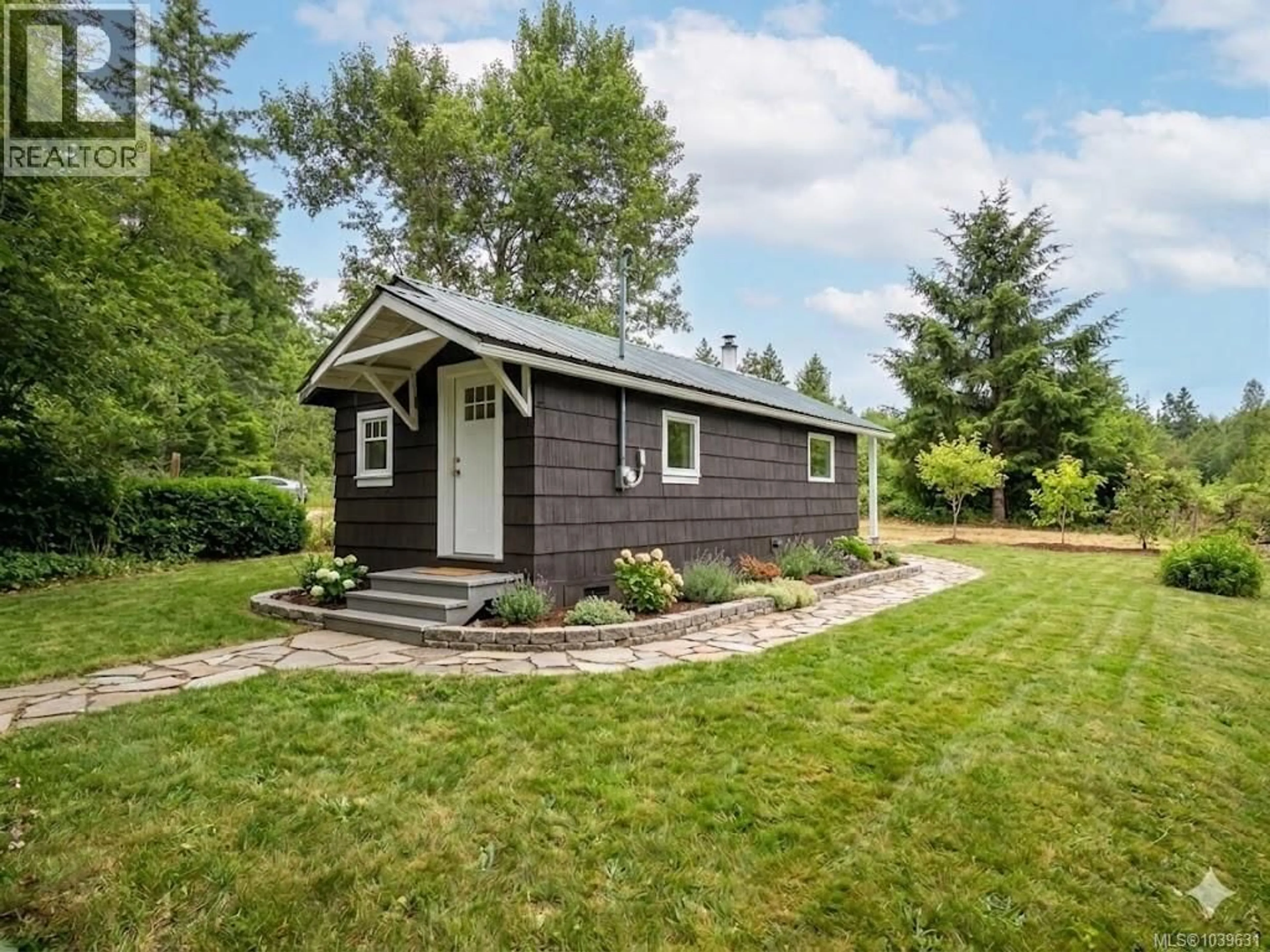 Home with vinyl exterior material, street for 1055 STATION ROAD, Coombs British Columbia V0R1M0