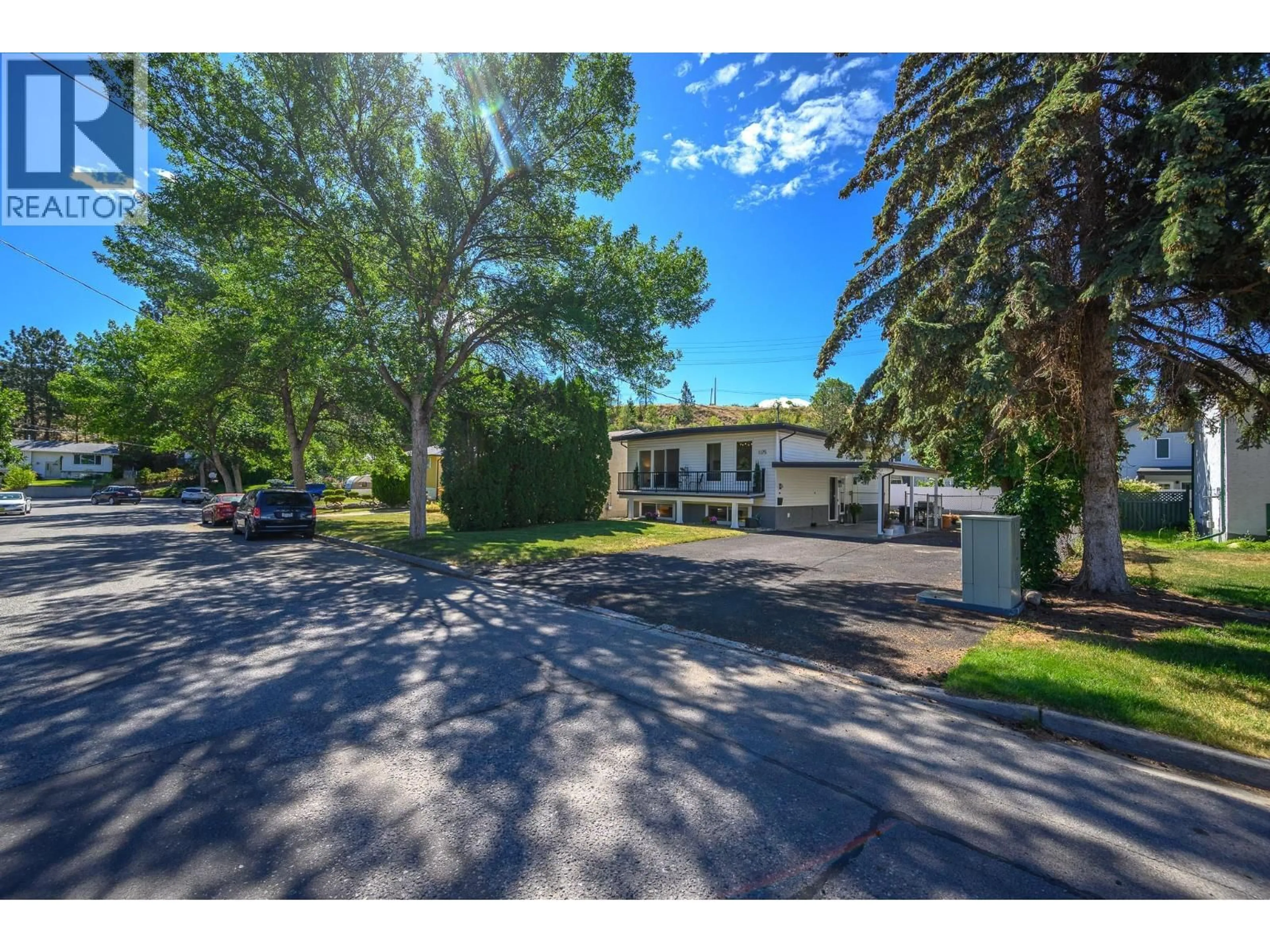 A pic from outside/outdoor area/front of a property/back of a property/a pic from drone, street for 1175 NEPTUNE ROAD, Kelowna British Columbia V1X3E4