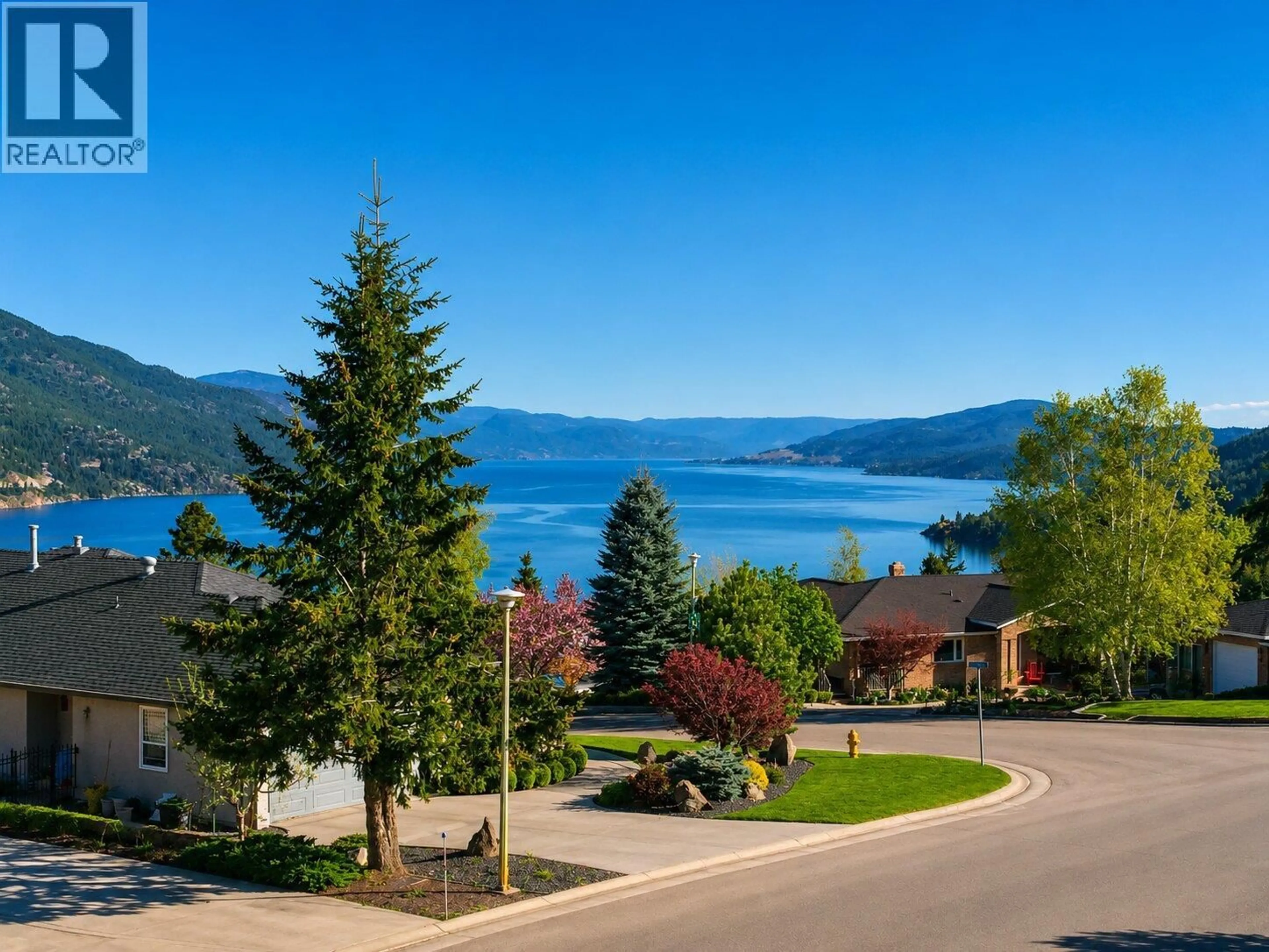 A pic from outside/outdoor area/front of a property/back of a property/a pic from drone, water/lake/river/ocean view for 183 MAGIC DRIVE, Kelowna British Columbia V1V1N2