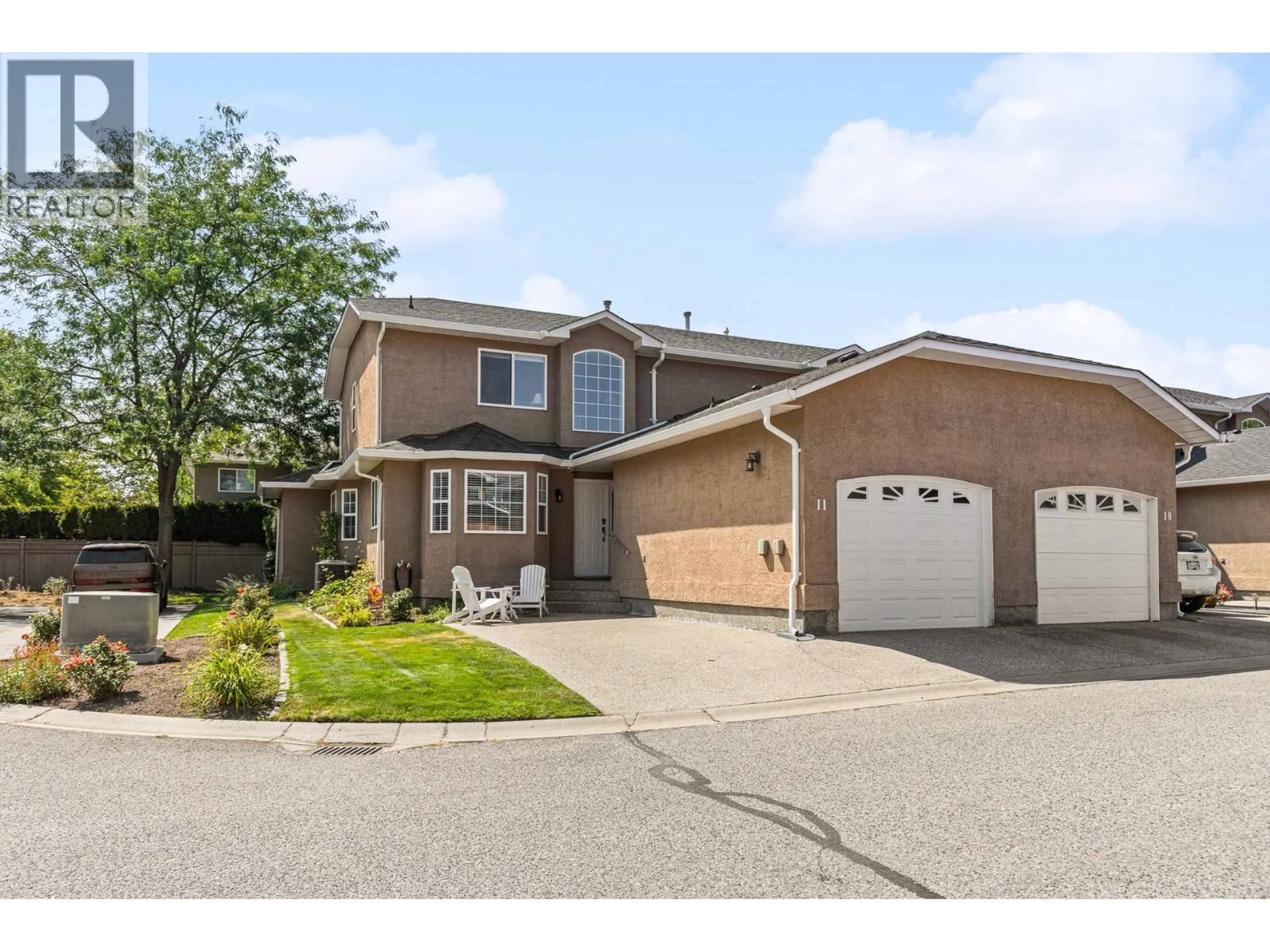 Home with vinyl exterior material, street for 11 - 535 GLENMEADOWS ROAD, Kelowna British Columbia V1V1X7