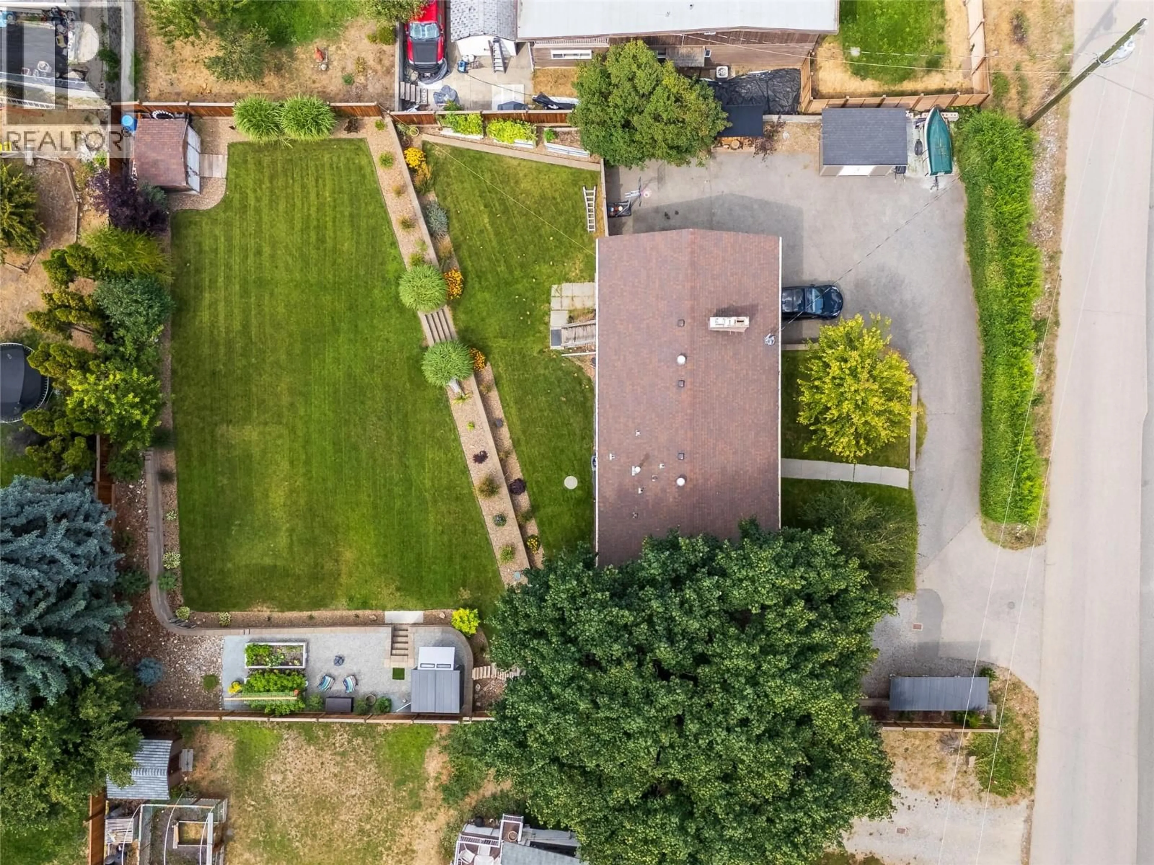 A pic from outside/outdoor area/front of a property/back of a property/a pic from drone, street for 5054 CHUTE LAKE CRESCENT, Kelowna British Columbia V1W4L9