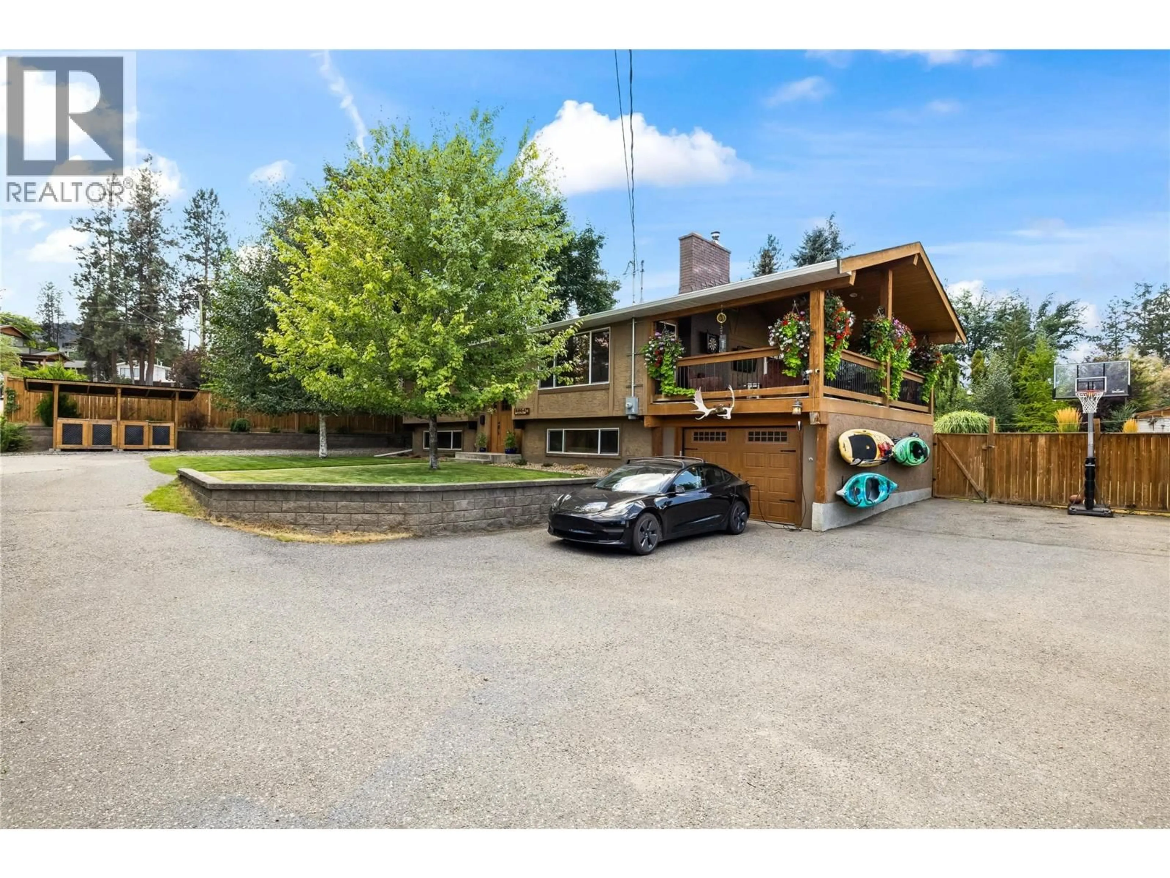 A pic from outside/outdoor area/front of a property/back of a property/a pic from drone, street for 5054 CHUTE LAKE CRESCENT, Kelowna British Columbia V1W4L9