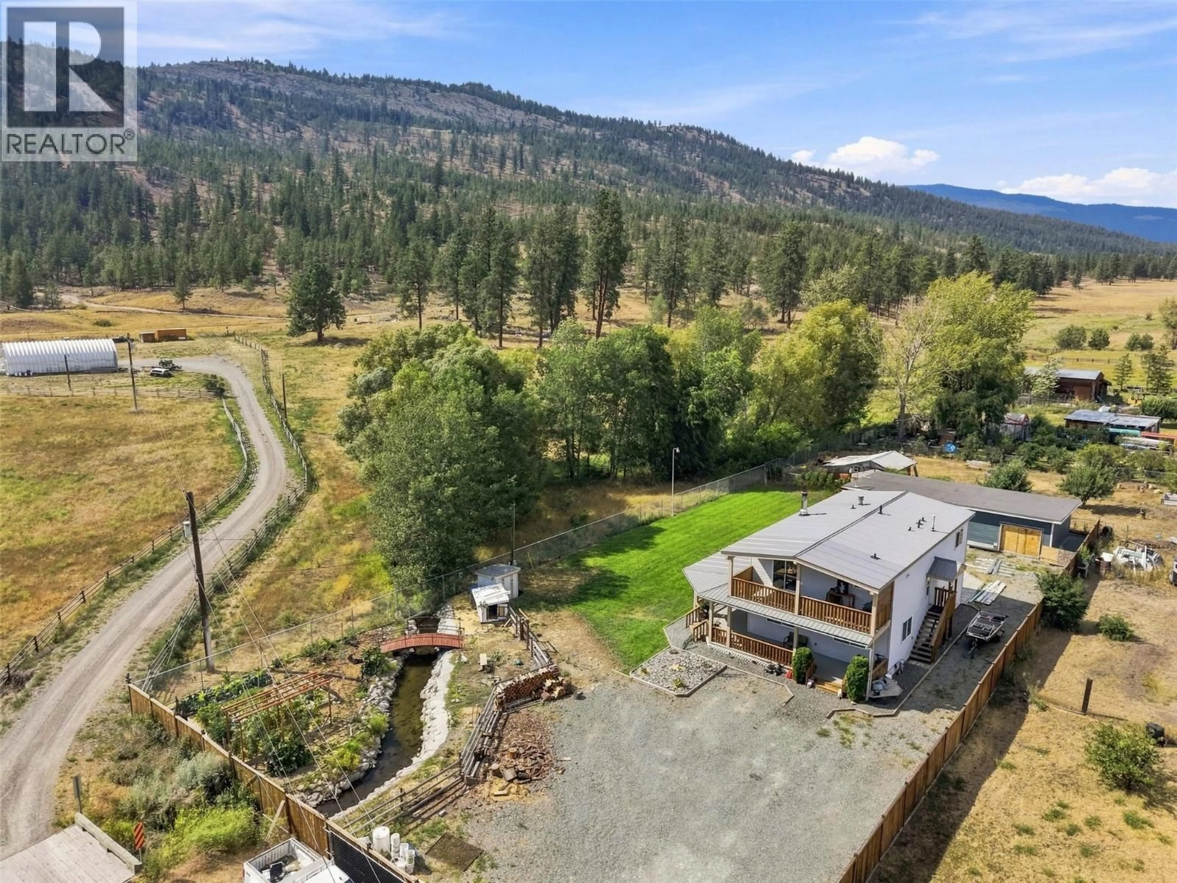 A pic from outside/outdoor area/front of a property/back of a property/a pic from drone, mountain view for 471 WOODWARD AVENUE, Merritt British Columbia V0K1Y0
