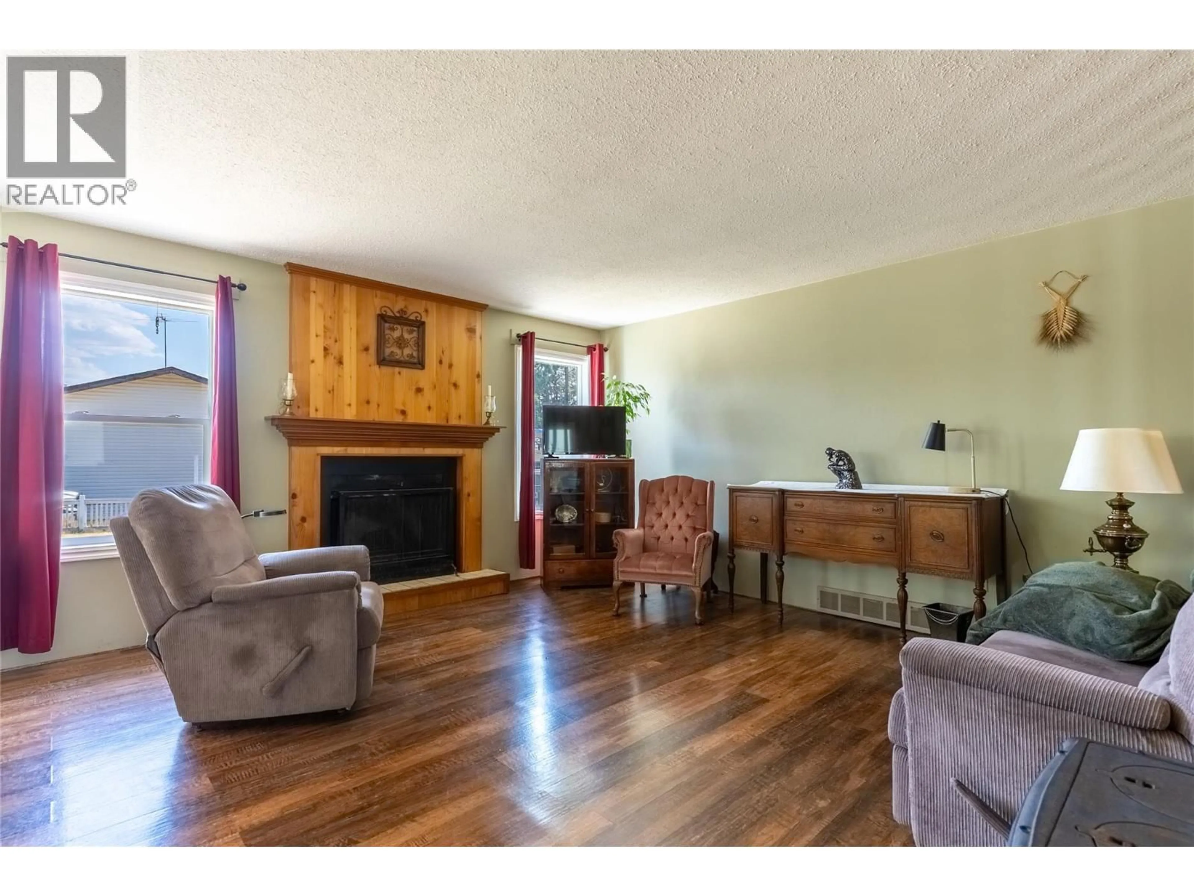 Living room with furniture, wood/laminate floor for 297 CHESTNUT COURT, Logan Lake British Columbia V0K1W0