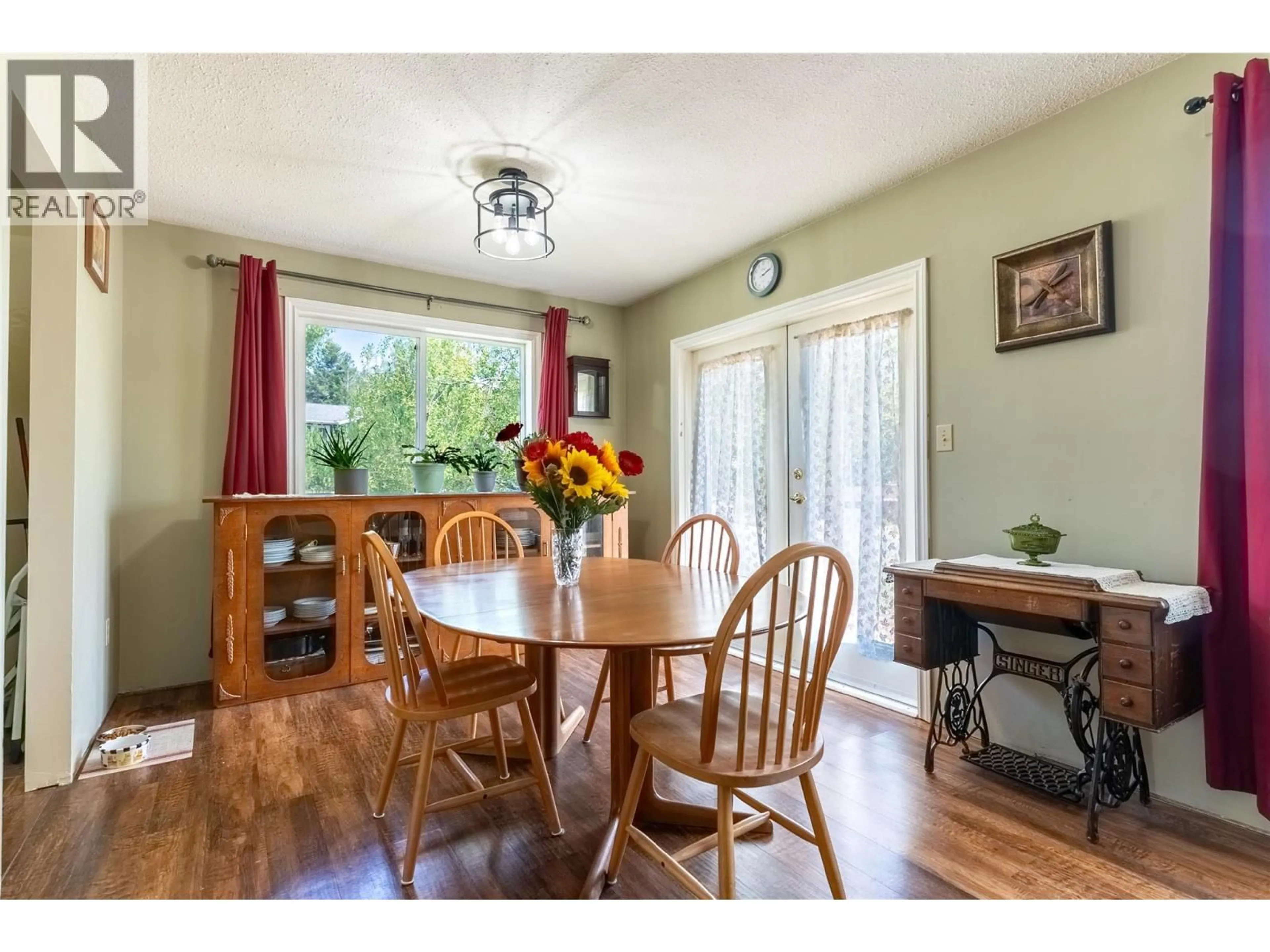Dining room, wood/laminate floor for 297 CHESTNUT COURT, Logan Lake British Columbia V0K1W0