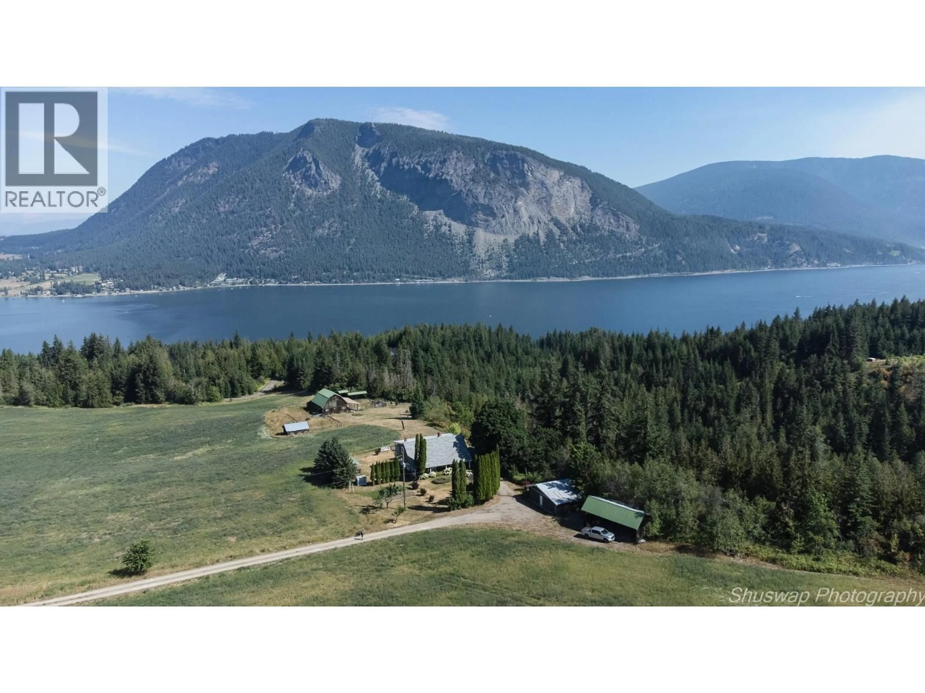 A pic from outside/outdoor area/front of a property/back of a property/a pic from drone, mountain view for 6350 LAKESHORE DRIVE NORTHEAST, Salmon Arm British Columbia V1E4N1