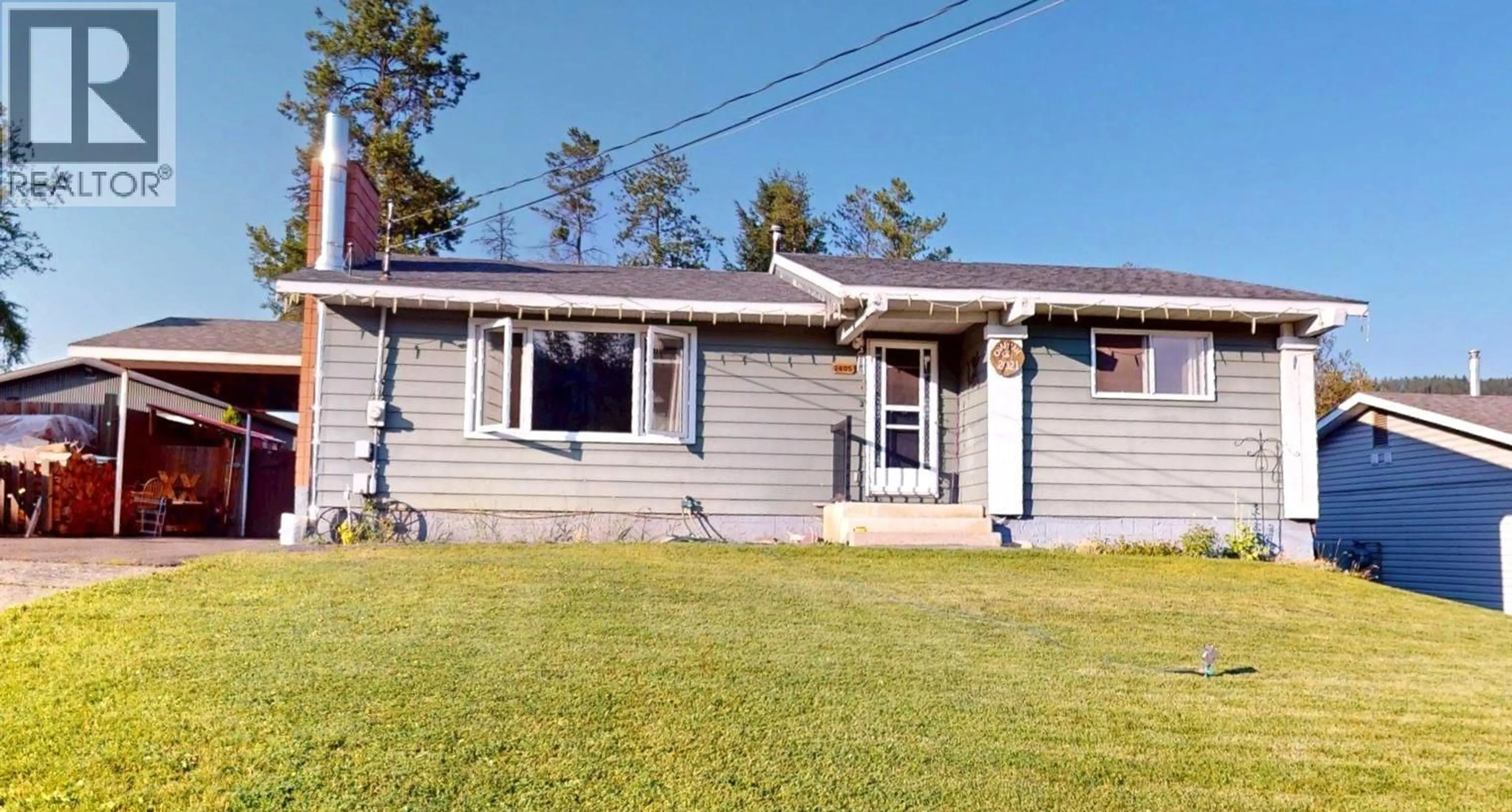 Home with vinyl exterior material, street for 2405 ARBUTUS STREET, Elkford British Columbia V0B1H0