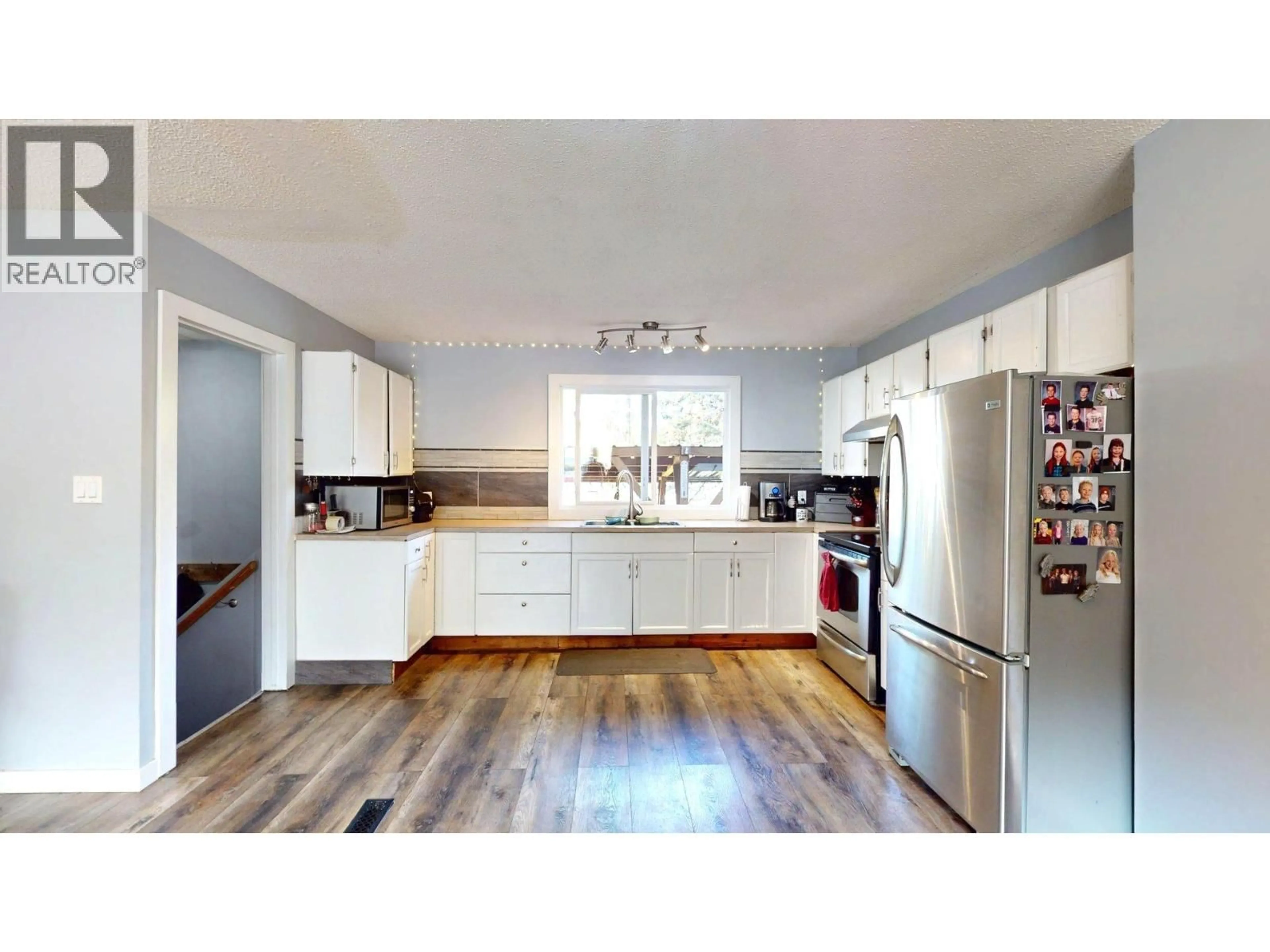 Open concept kitchen, wood/laminate floor for 2405 ARBUTUS STREET, Elkford British Columbia V0B1H0