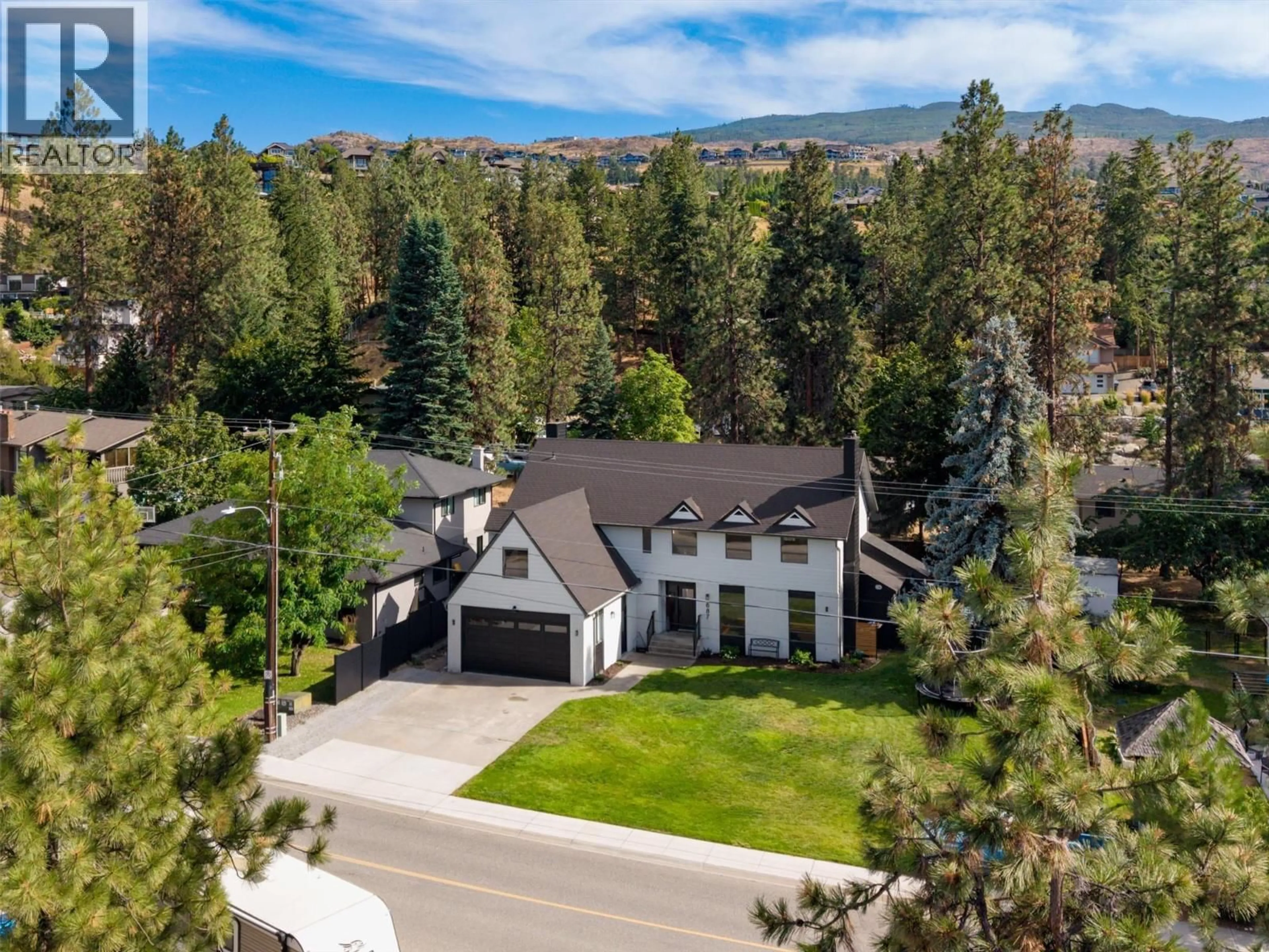 A pic from outside/outdoor area/front of a property/back of a property/a pic from drone, mountain view for 687 BARNABY ROAD, Kelowna British Columbia V1W4N8