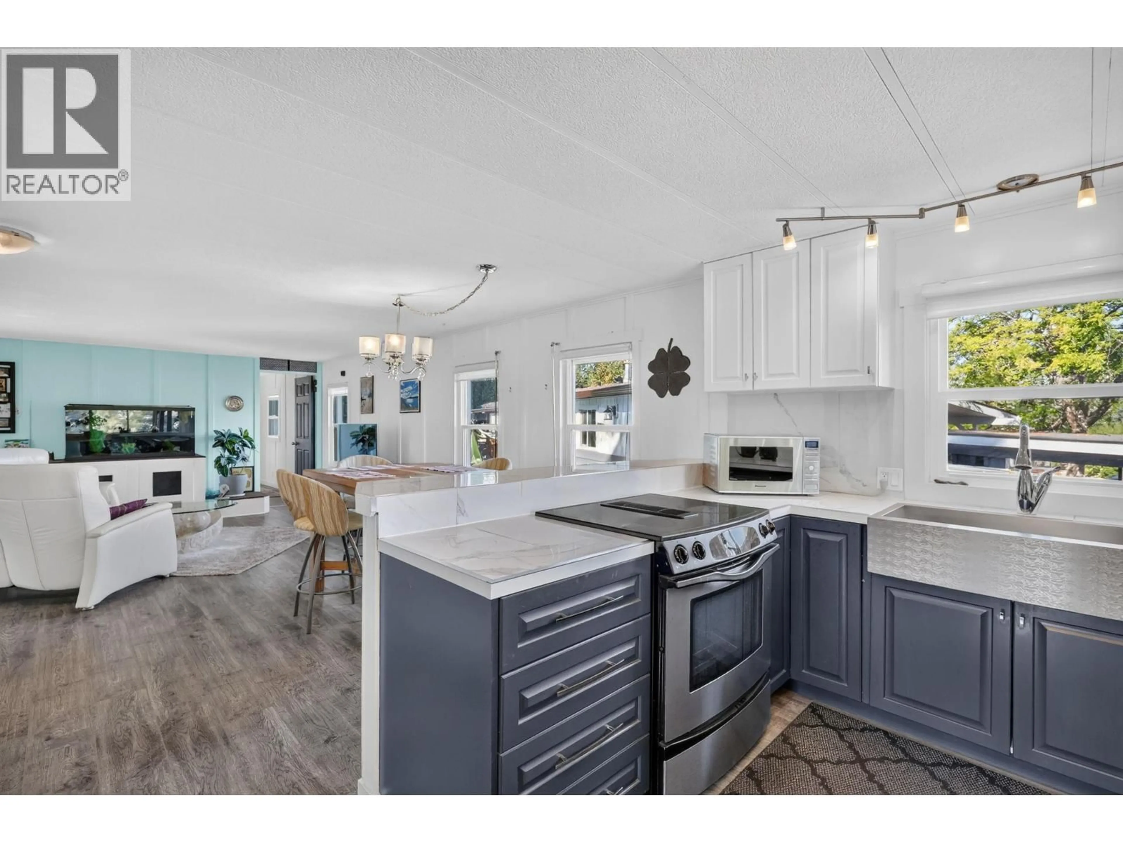 Open concept kitchen, ceramic/tile floor for 50 - 4075 MCCLAIN ROAD, Kelowna British Columbia V1W4R4