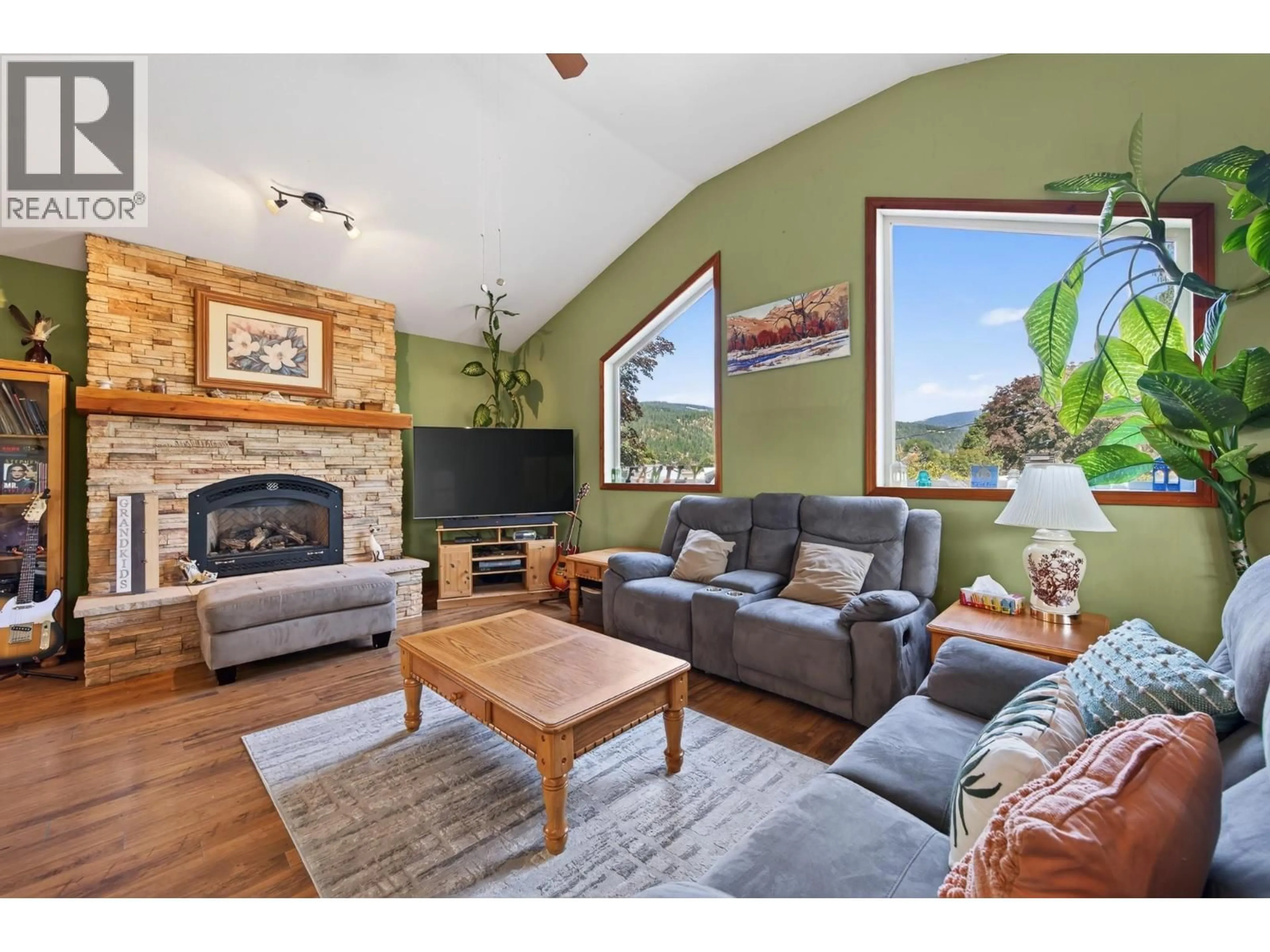 Living room with furniture, wood/laminate floor for 6750 HEFFLEY ROAD, Kamloops British Columbia V2H0B4