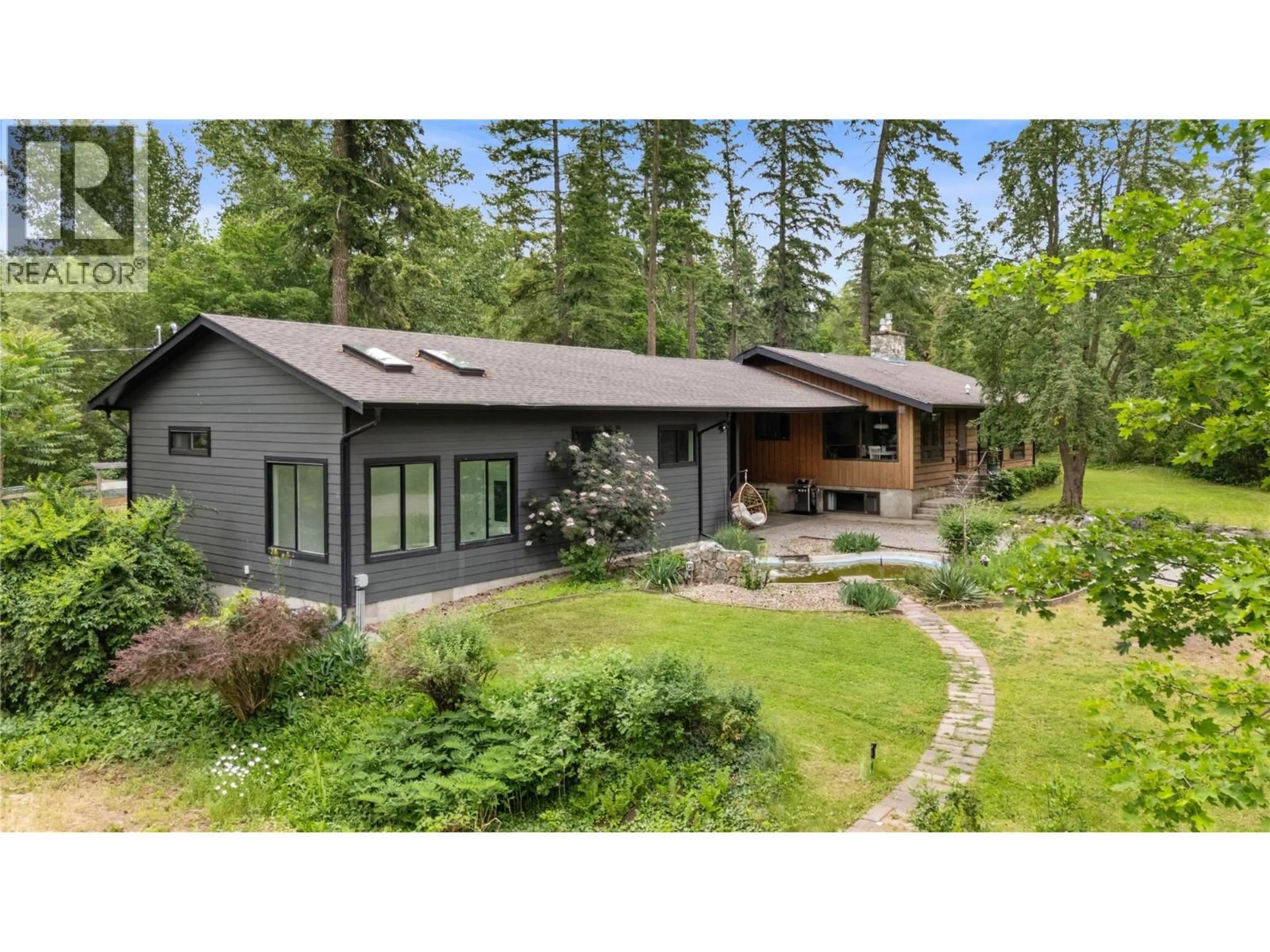 A pic from outside/outdoor area/front of a property/back of a property/a pic from drone, forest/trees view for 3153 HALL ROAD, Kelowna British Columbia V1W2R8