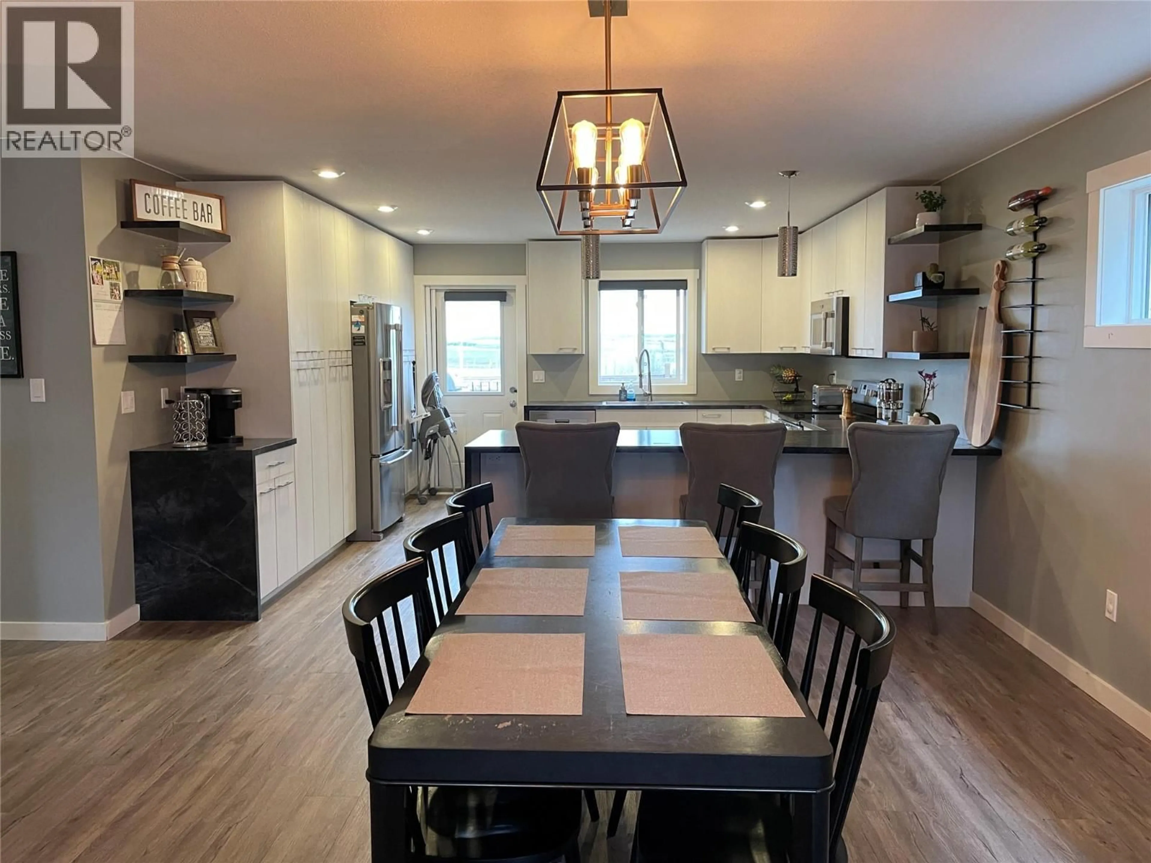 Open concept kitchen, wood/laminate floor for 8221 19A STREET, Dawson Creek British Columbia V1G0J6