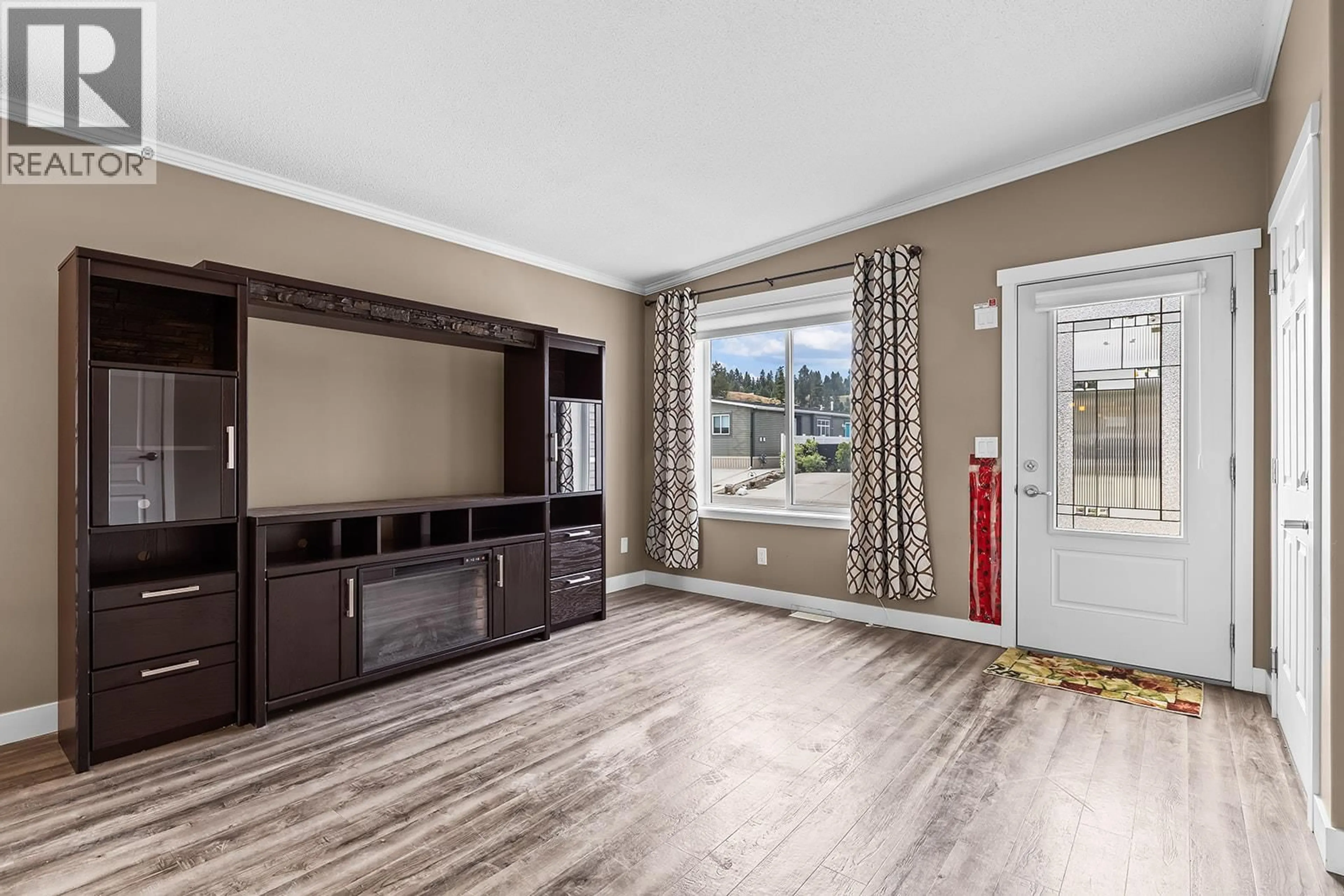 Living room with furniture, wood/laminate floor for 34 - 1835 NANCEE WAY COURT, West Kelowna British Columbia V1Z4C1