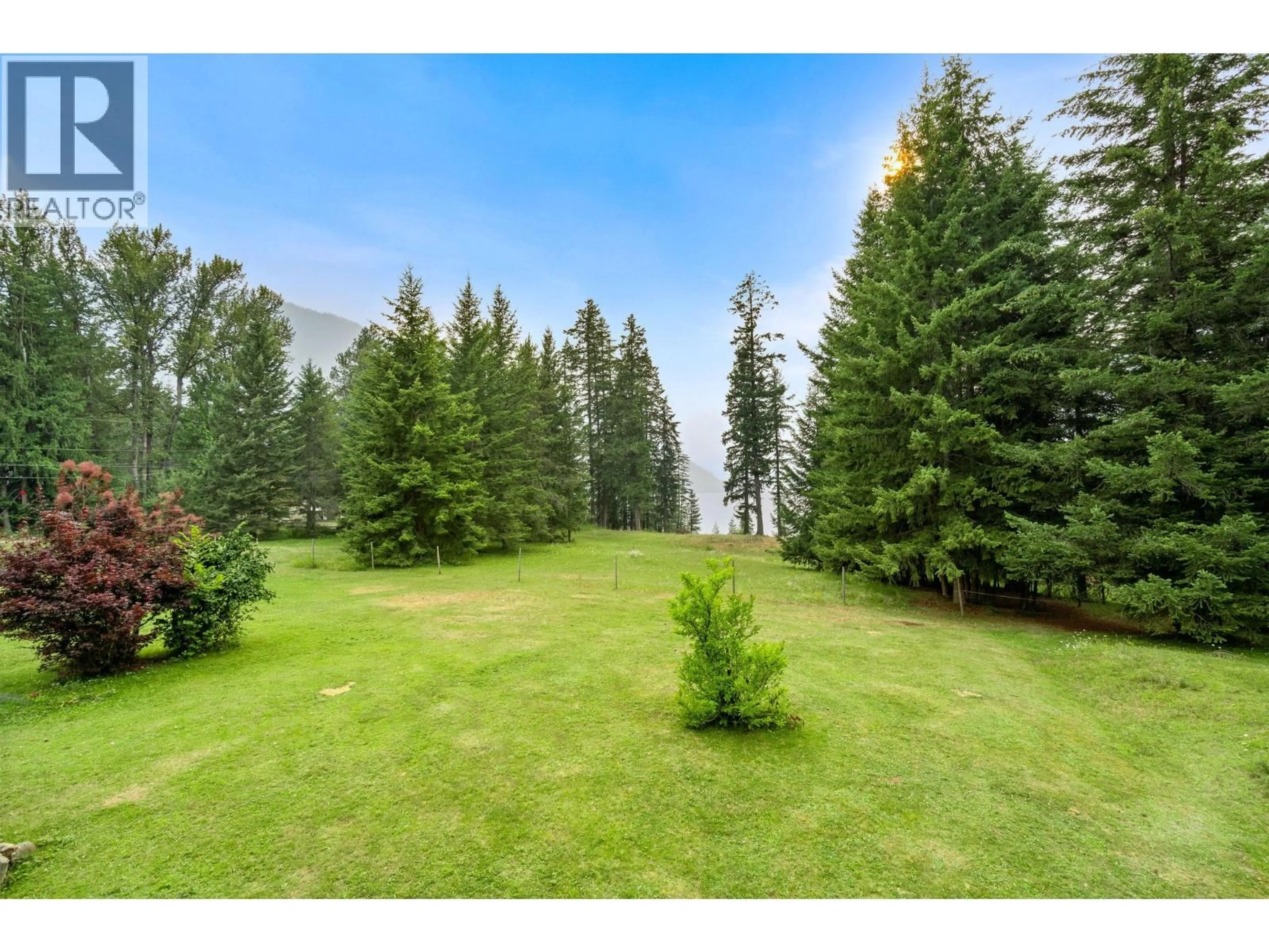 A pic from outside/outdoor area/front of a property/back of a property/a pic from drone, forest/trees view for 118 BAKER ROAD, Burton British Columbia V0G1R0