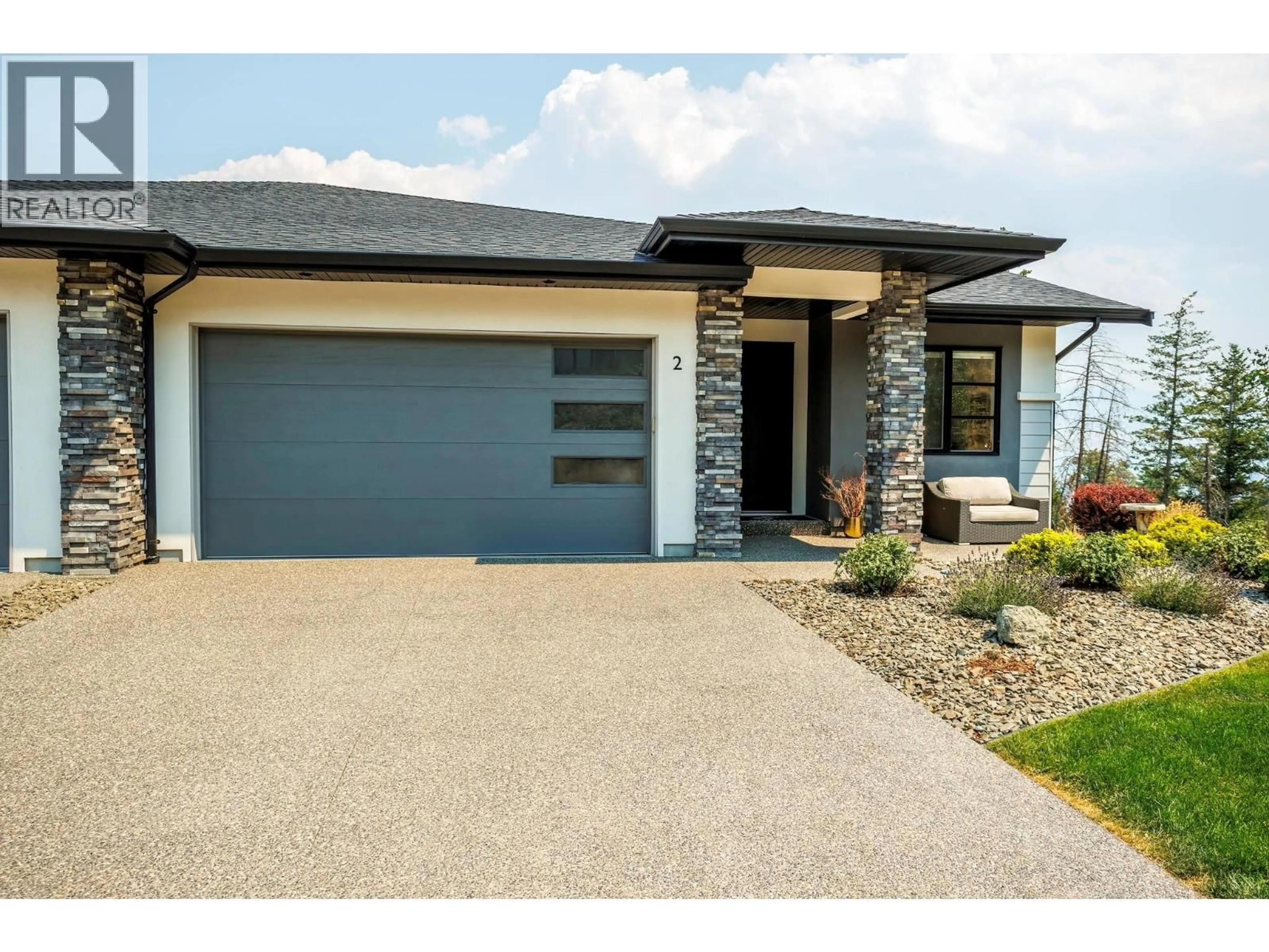Home with brick exterior material, street for 2 - 1349 ROCKY POINT DRIVE, Kelowna British Columbia V1V0B5