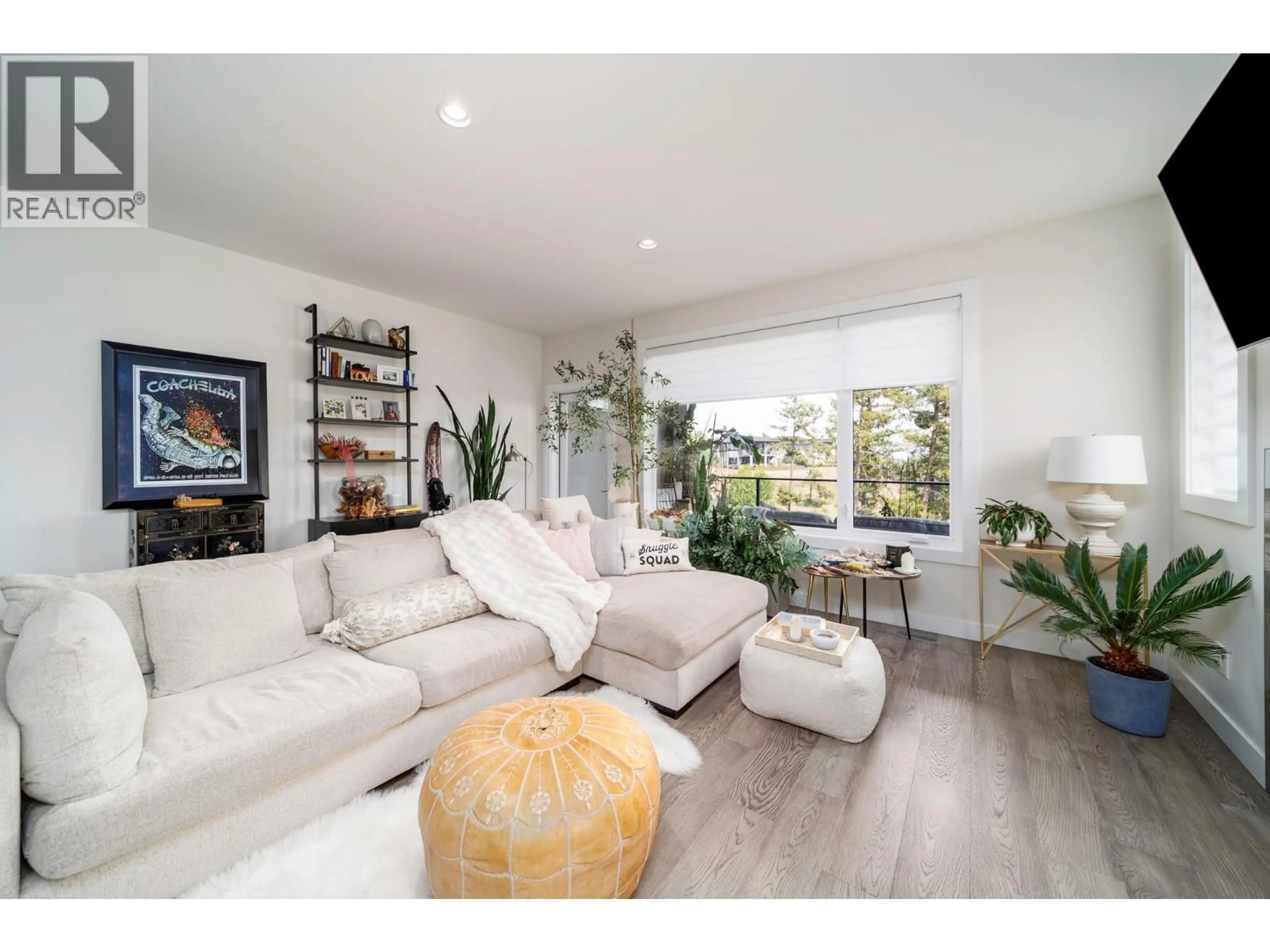 Living room with furniture, wood/laminate floor for 2 - 1349 ROCKY POINT DRIVE, Kelowna British Columbia V1V0B5