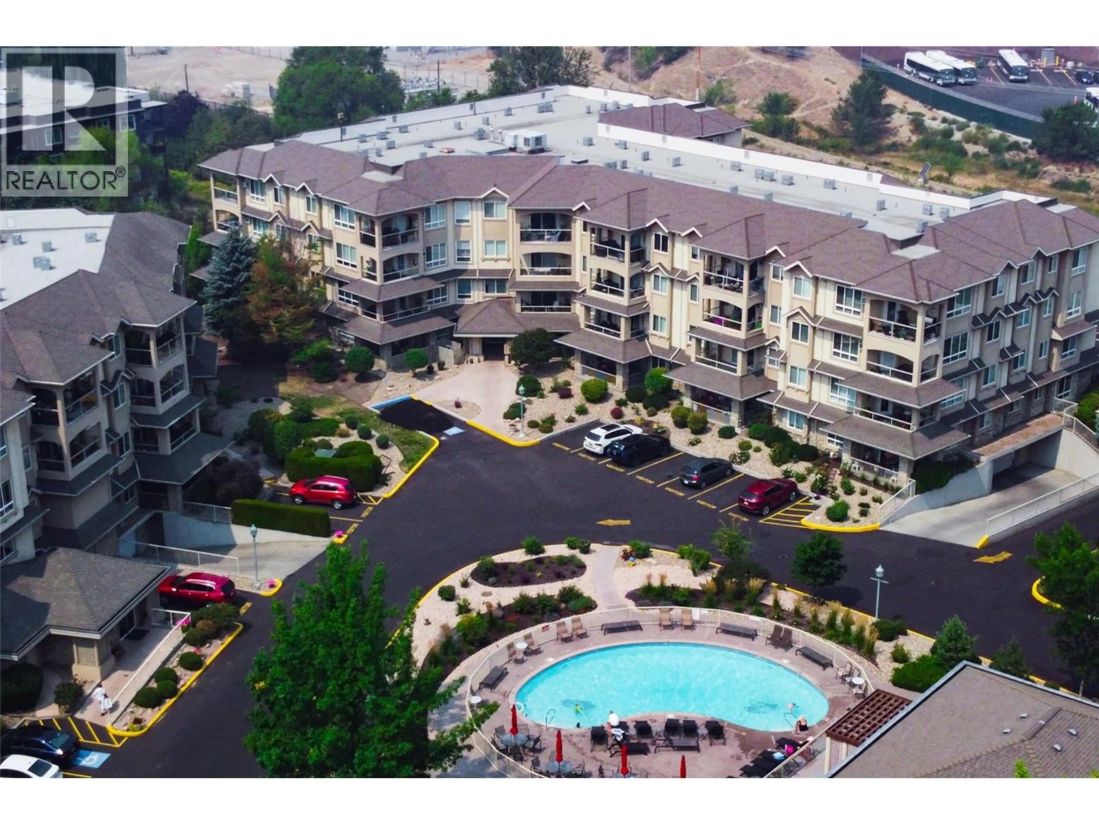 A pic from outside/outdoor area/front of a property/back of a property/a pic from drone, unknown for 401 - 1962 ENTERPRISE WAY, Kelowna British Columbia V1Y9S6