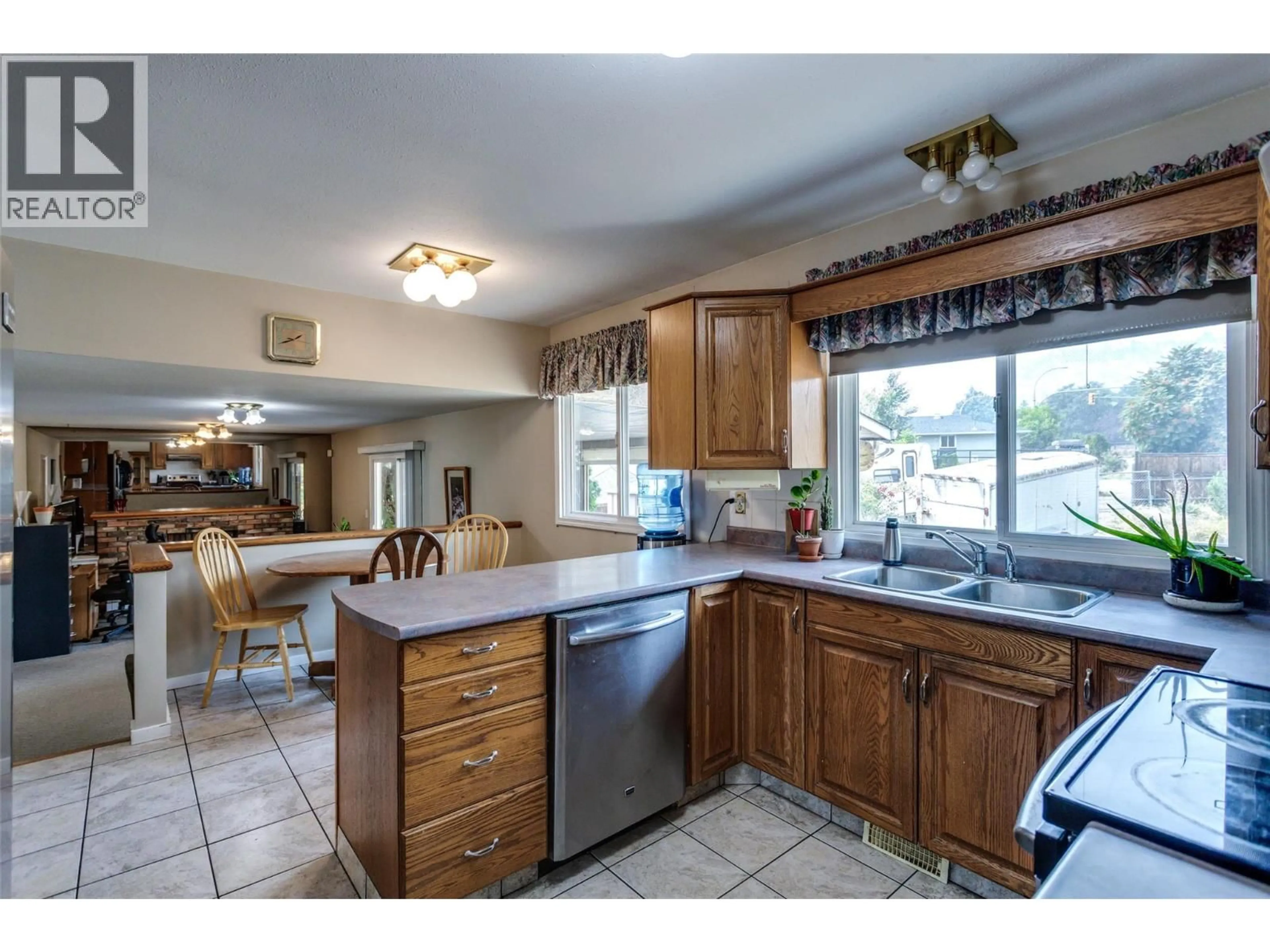 Open concept kitchen, ceramic/tile floor for 840 LIBAN COURT, Kelowna British Columbia V1Y8B5