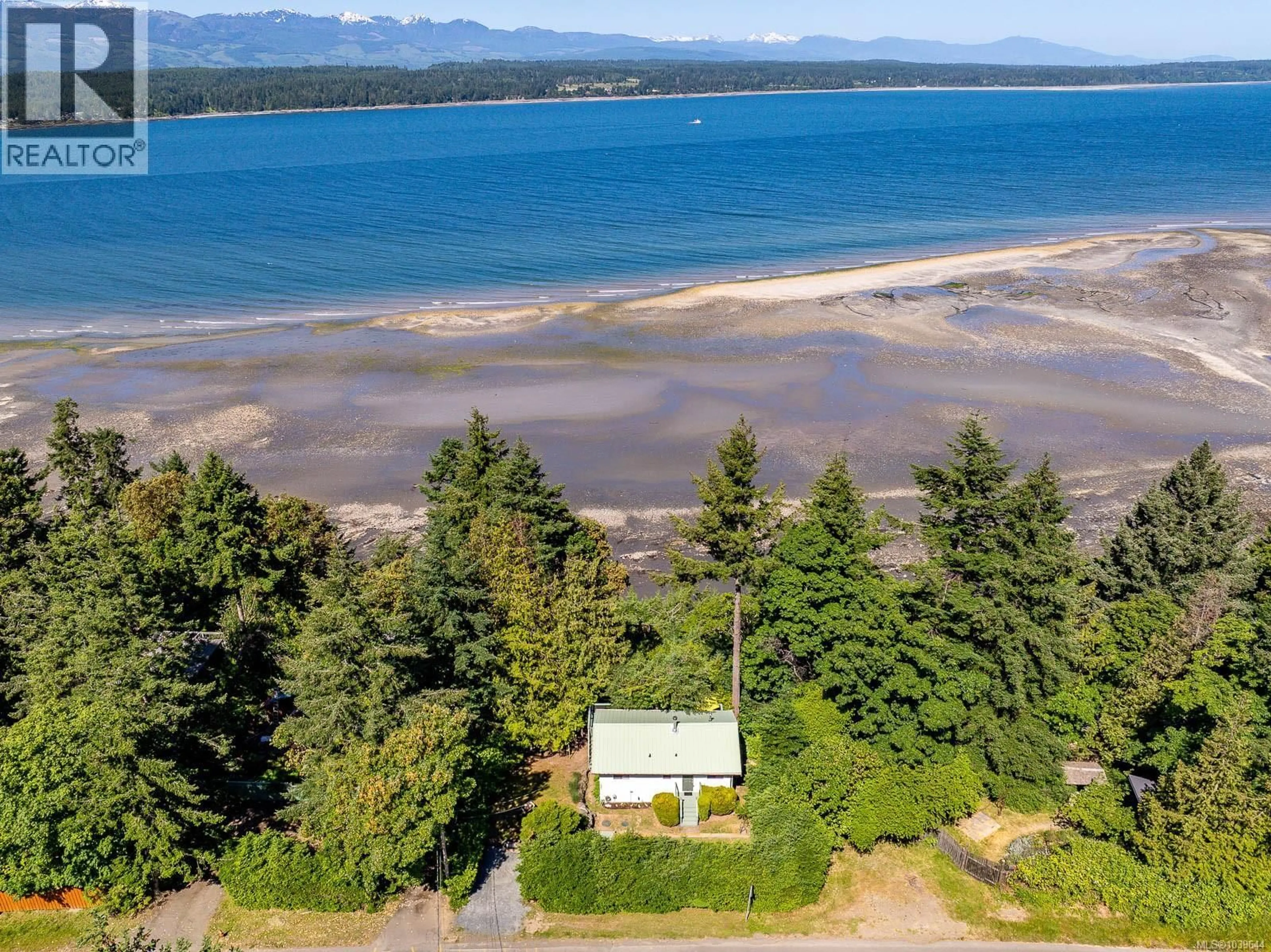A pic from outside/outdoor area/front of a property/back of a property/a pic from drone, water/lake/river/ocean view for 3845 SHINGLE SPIT ROAD, Hornby Island British Columbia V0R1Z0
