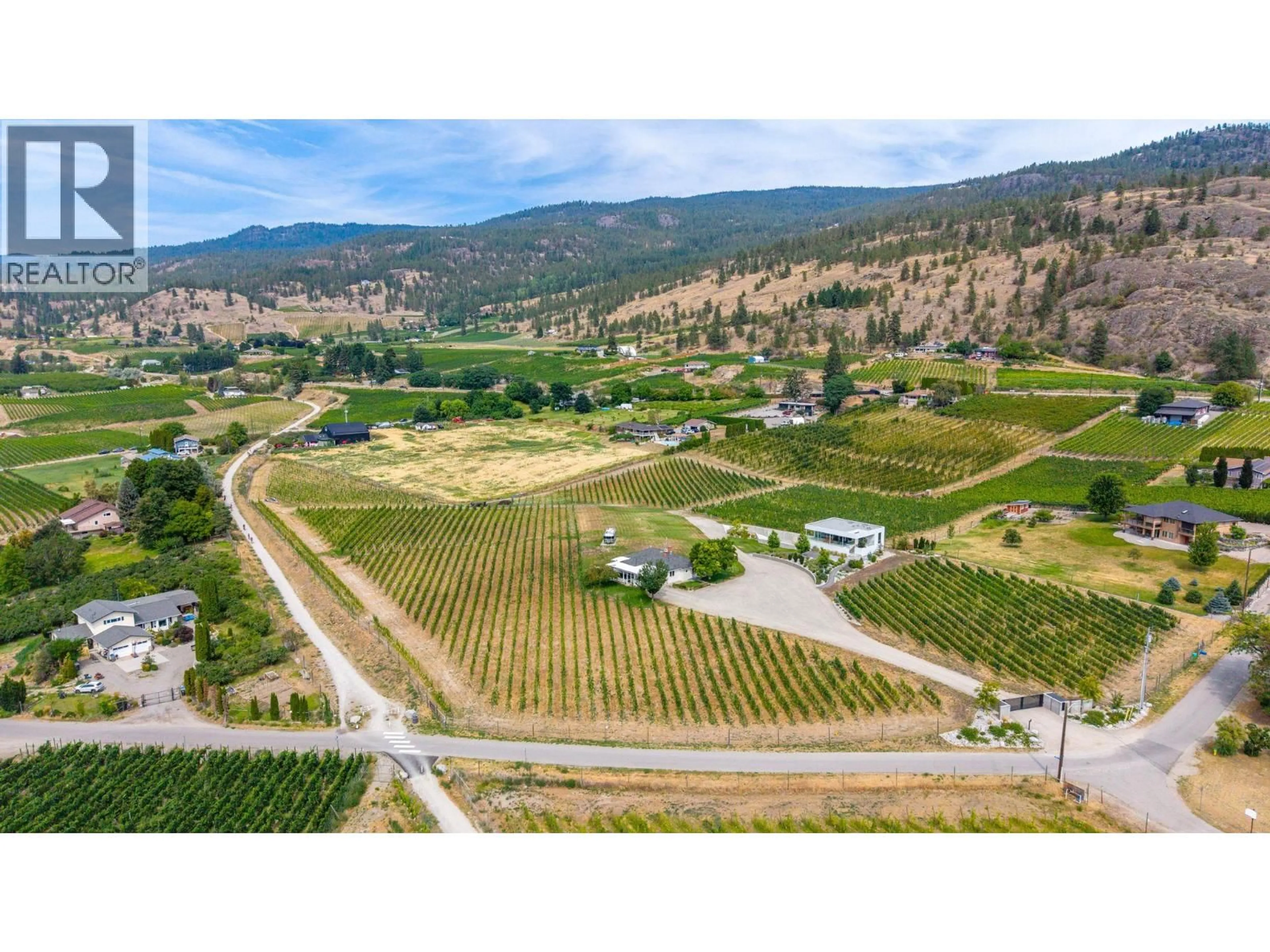 A pic from outside/outdoor area/front of a property/back of a property/a pic from drone, mountain view for 1243 EVANS AVENUE, Penticton British Columbia V2A8R7