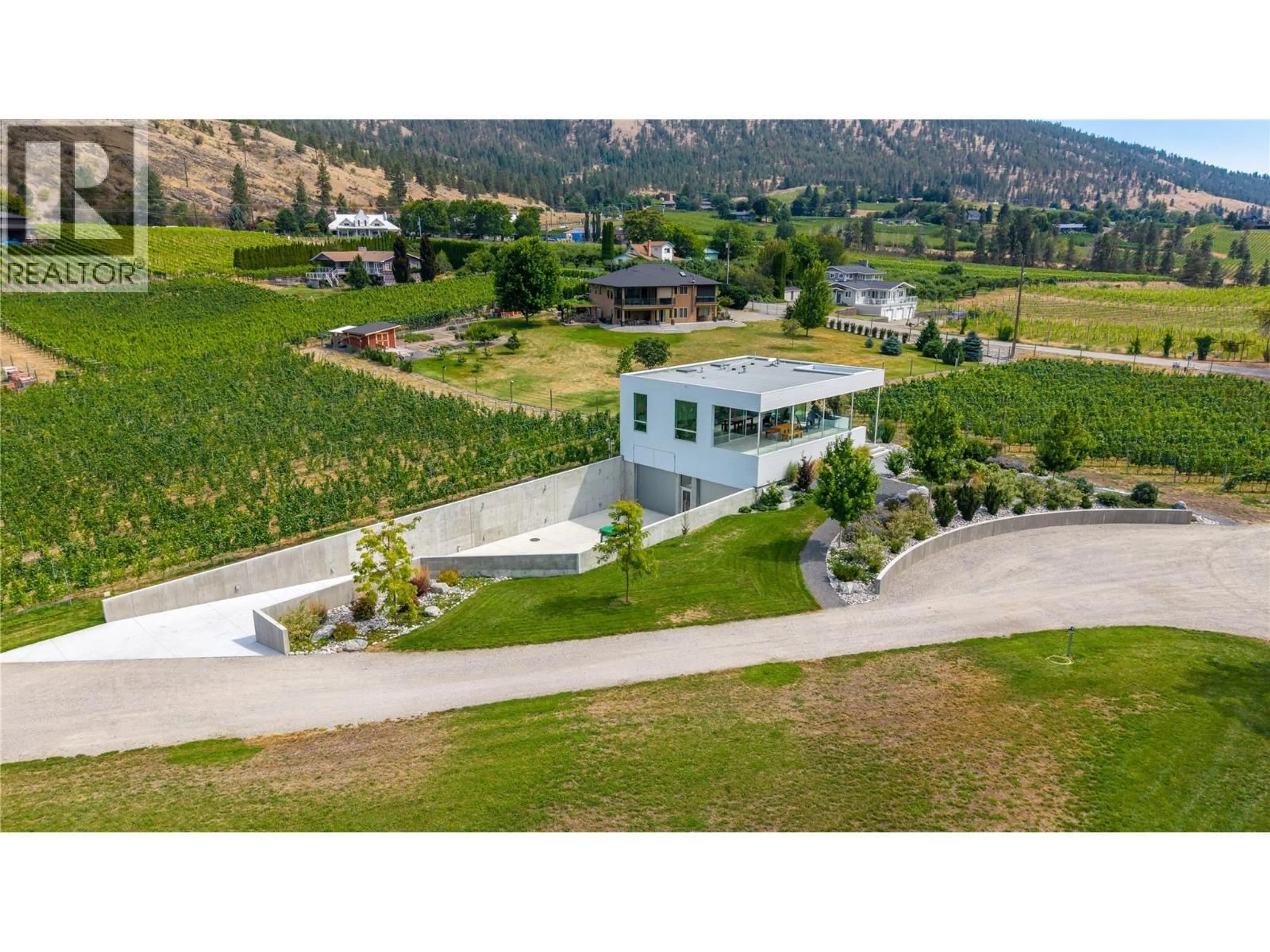 A pic from outside/outdoor area/front of a property/back of a property/a pic from drone, mountain view for 1243 EVANS AVENUE, Penticton British Columbia V2A8R7