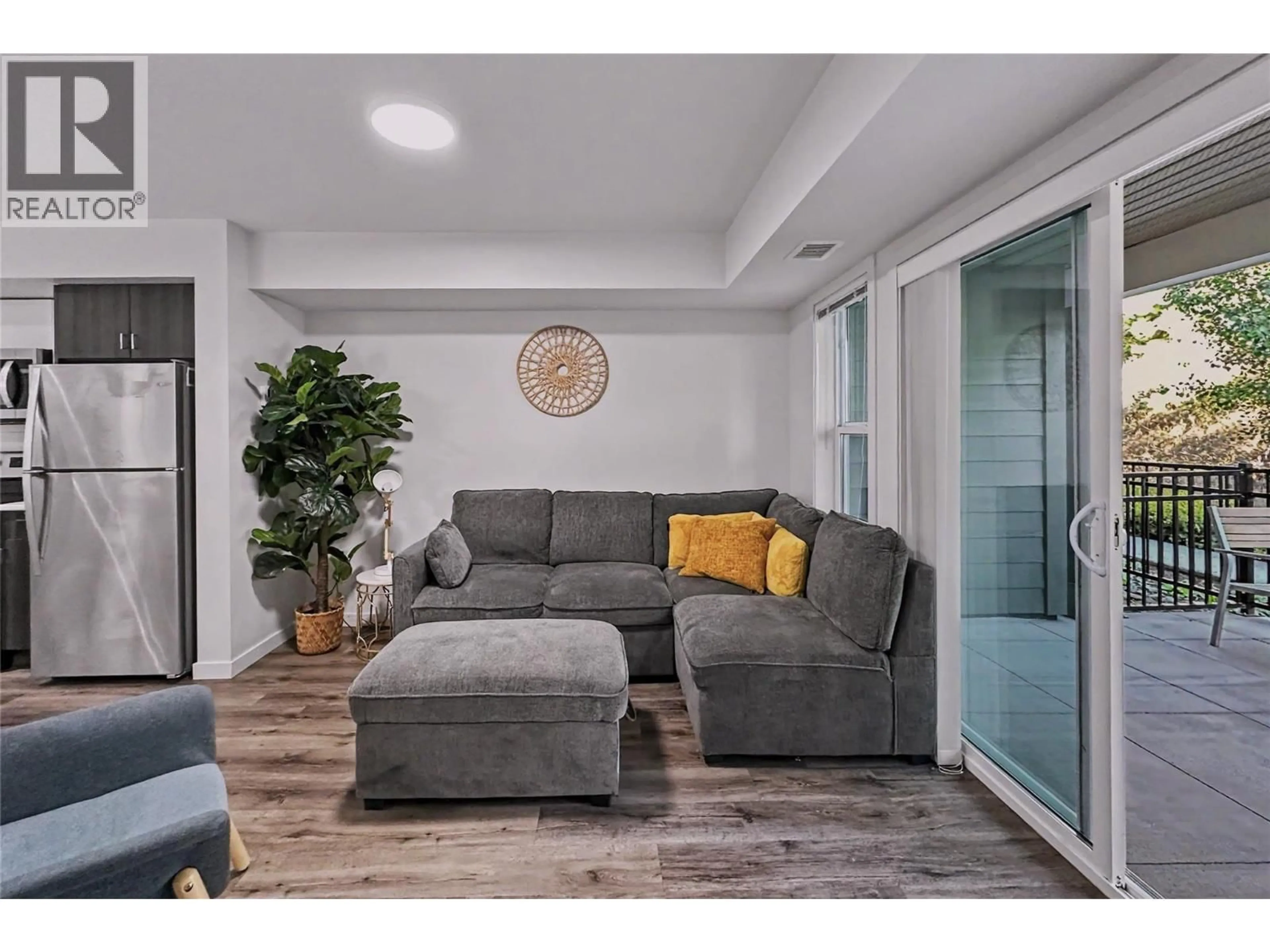 Living room with furniture, unknown for 115 - 725 ACADEMY WAY, Kelowna British Columbia V1V3E4