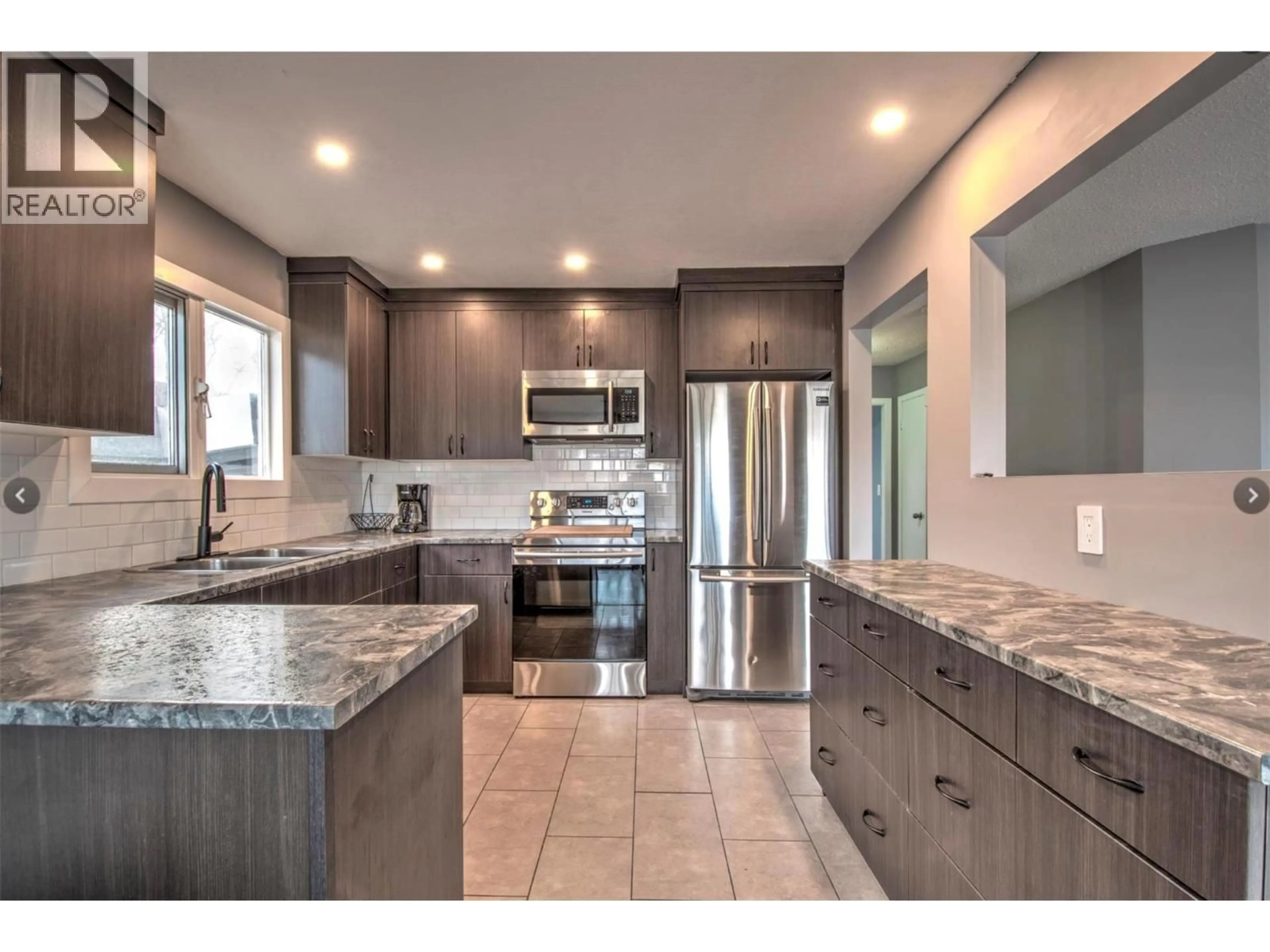 Open concept kitchen, ceramic/tile floor for 4202 16 AVENUE, Vernon British Columbia V1T6P1