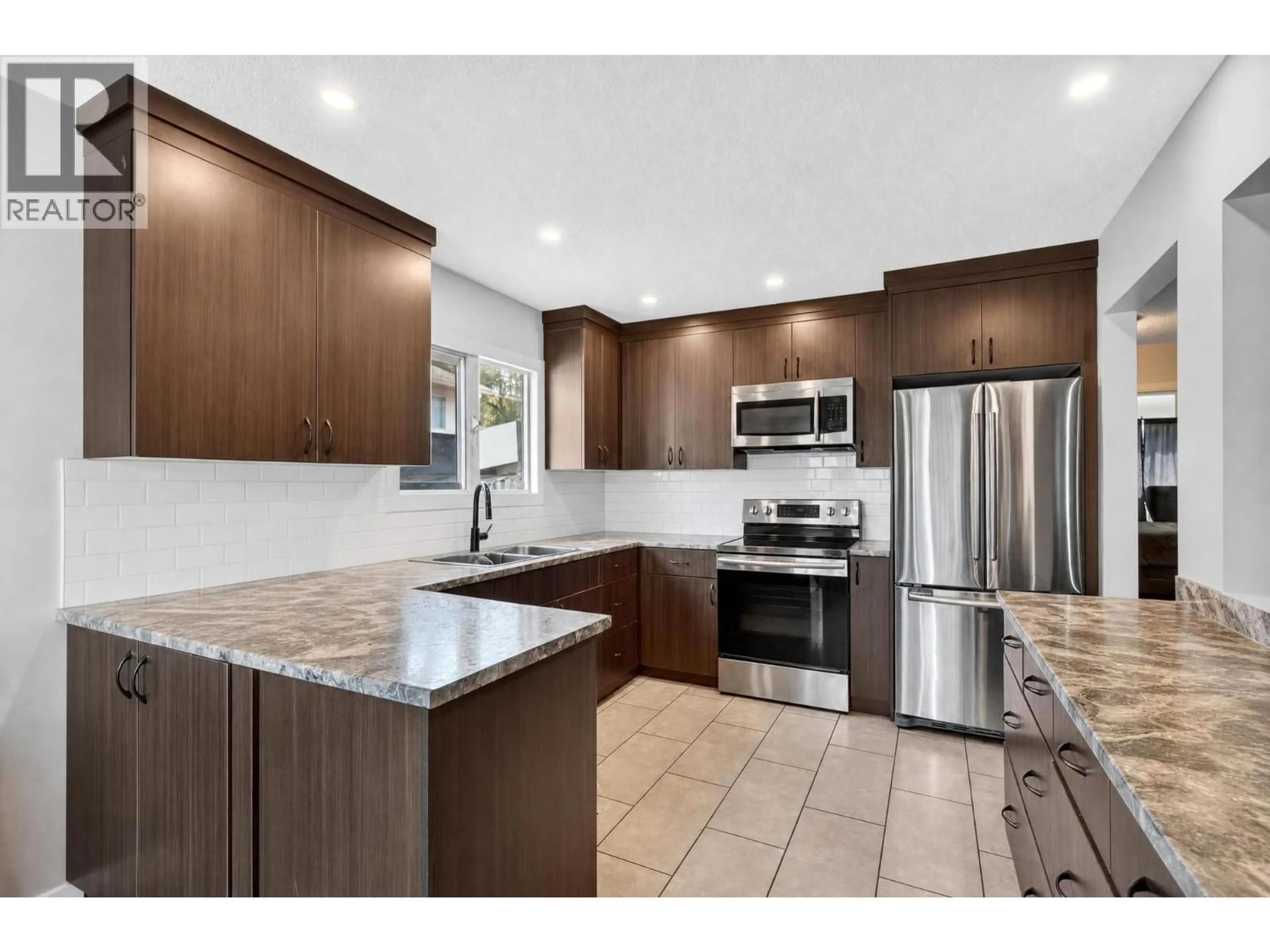 Open concept kitchen, ceramic/tile floor for 4202 16 AVENUE, Vernon British Columbia V1T6P1