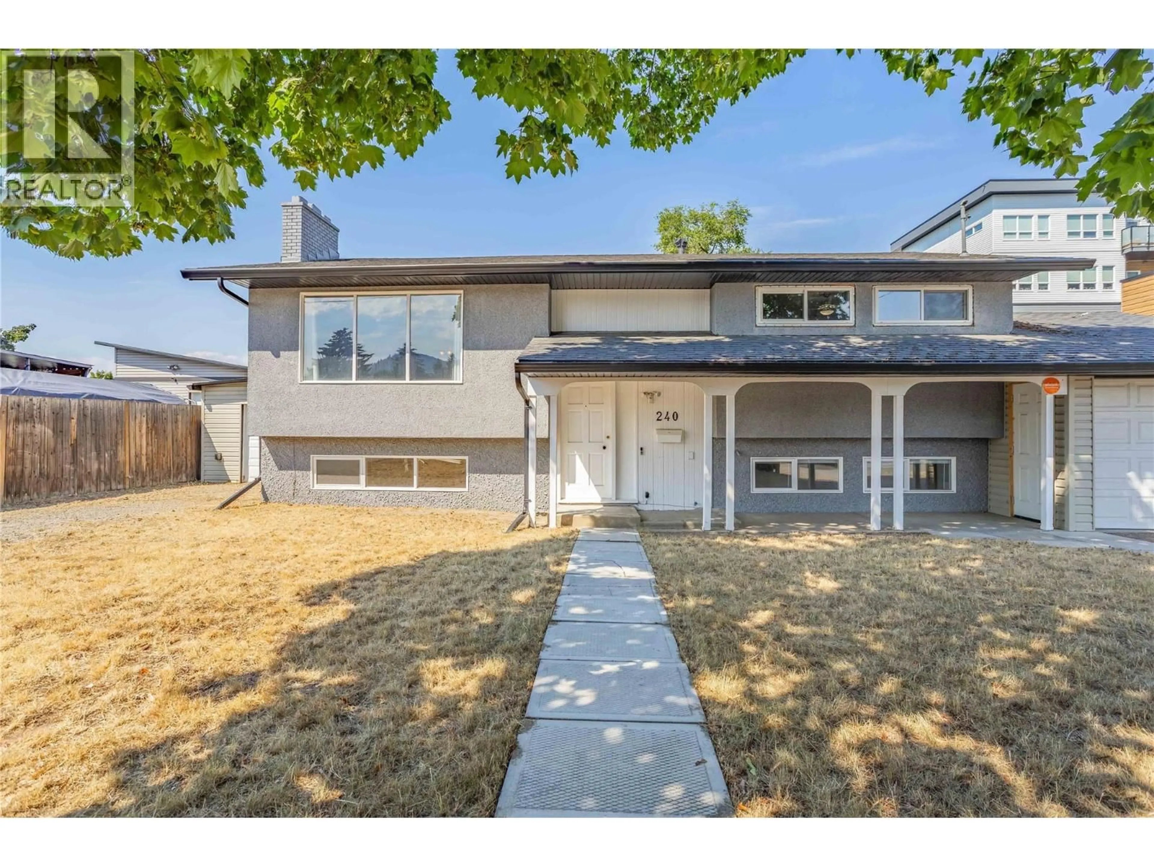 Home with vinyl exterior material, street for 240 PETCH ROAD, Kelowna British Columbia V1X3S4