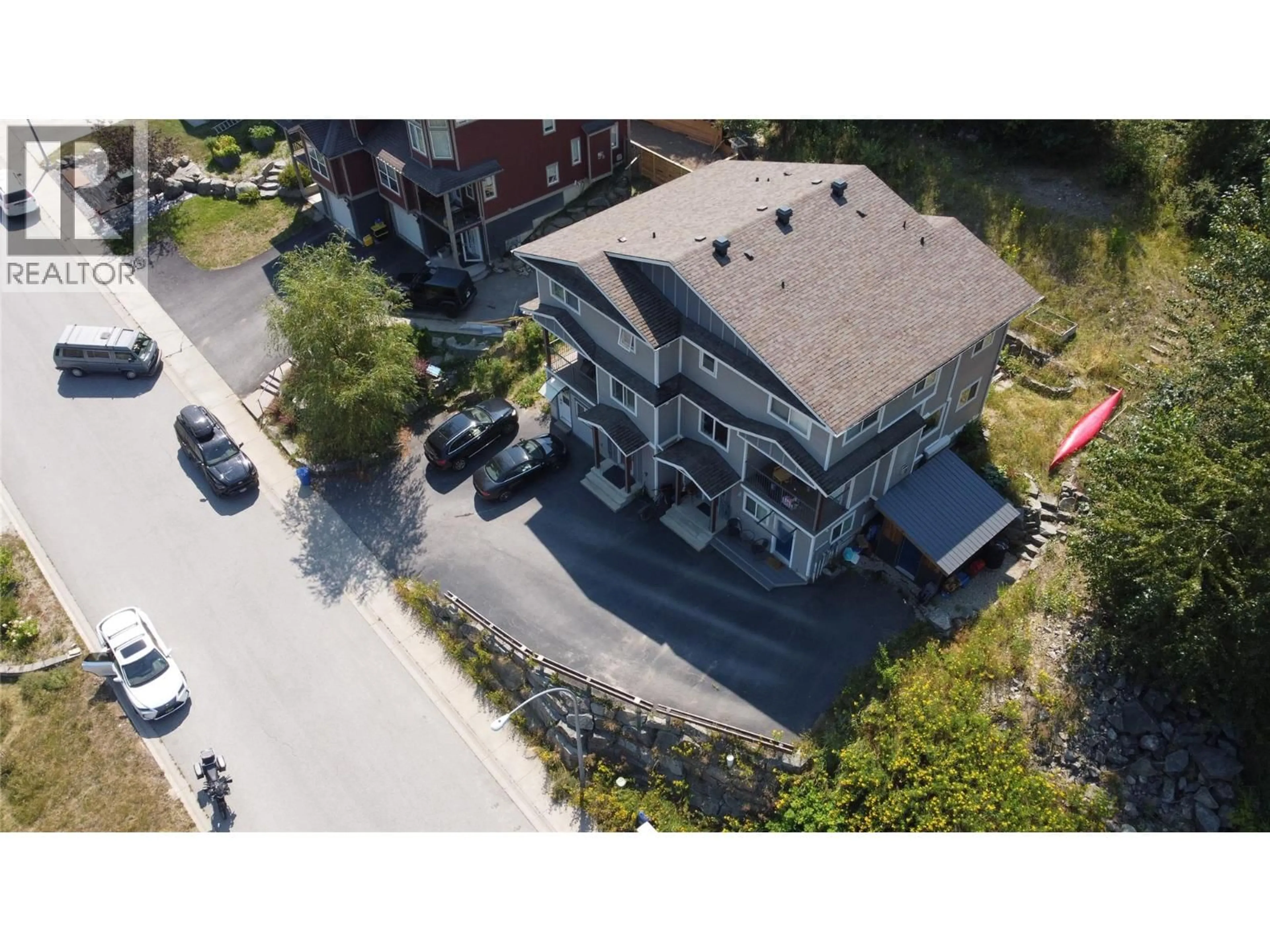 A pic from outside/outdoor area/front of a property/back of a property/a pic from drone, street for A - 2410 PERRIER LANE, Nelson British Columbia V1L7C3