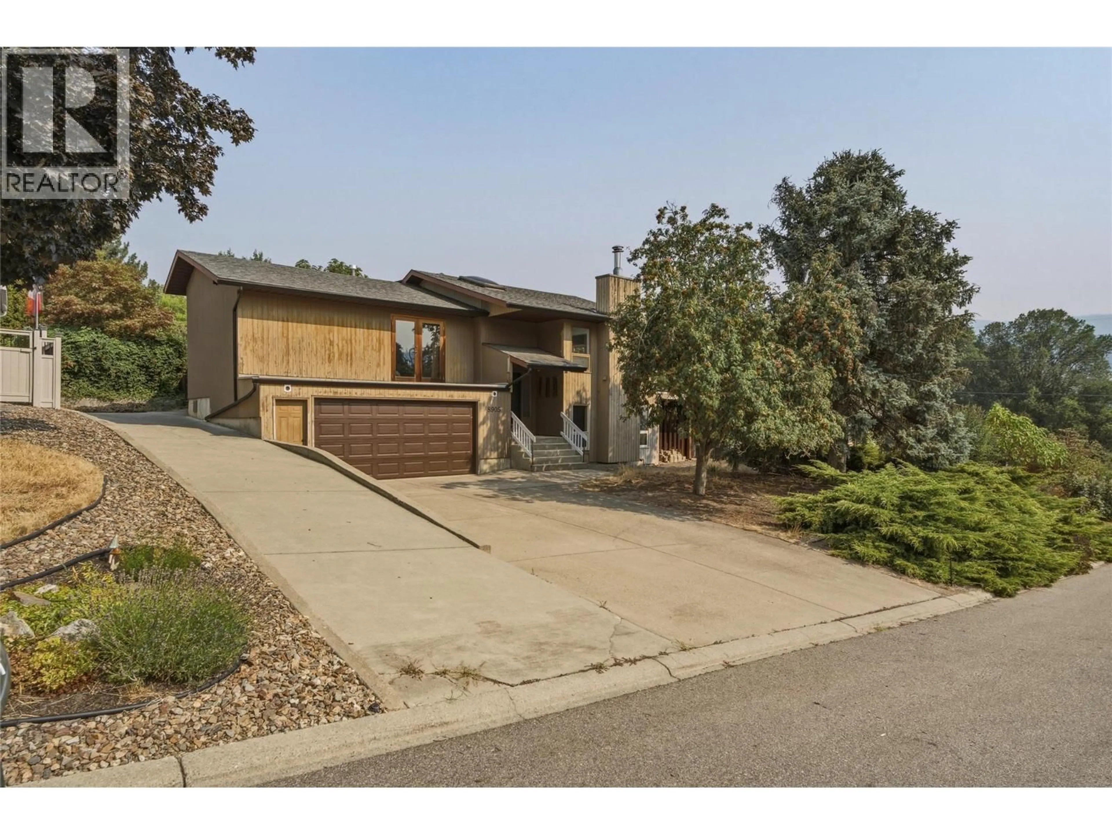 Home with brick exterior material, street for 8905 RUSSET DRIVE, Vernon British Columbia V1B2B7