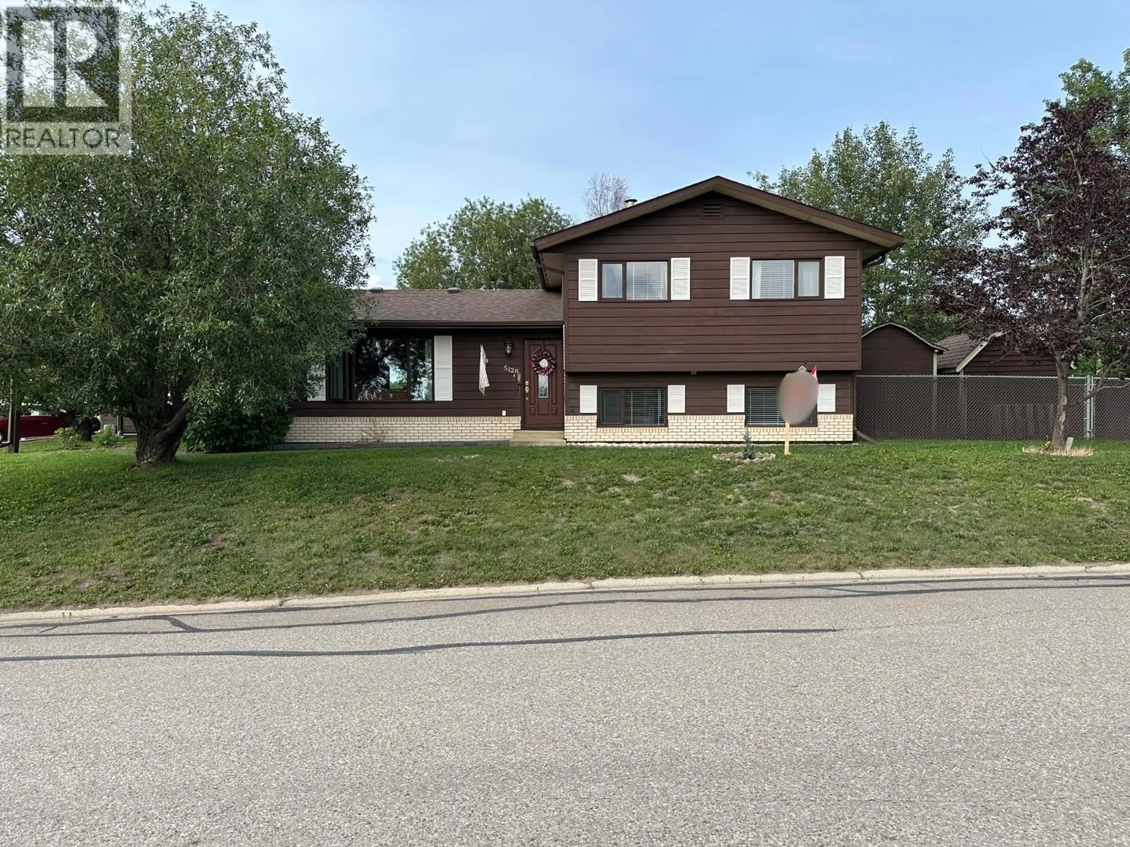 Home with vinyl exterior material, street for 5128 44 PLACE NORTHEAST, Chetwynd British Columbia V0C1J0