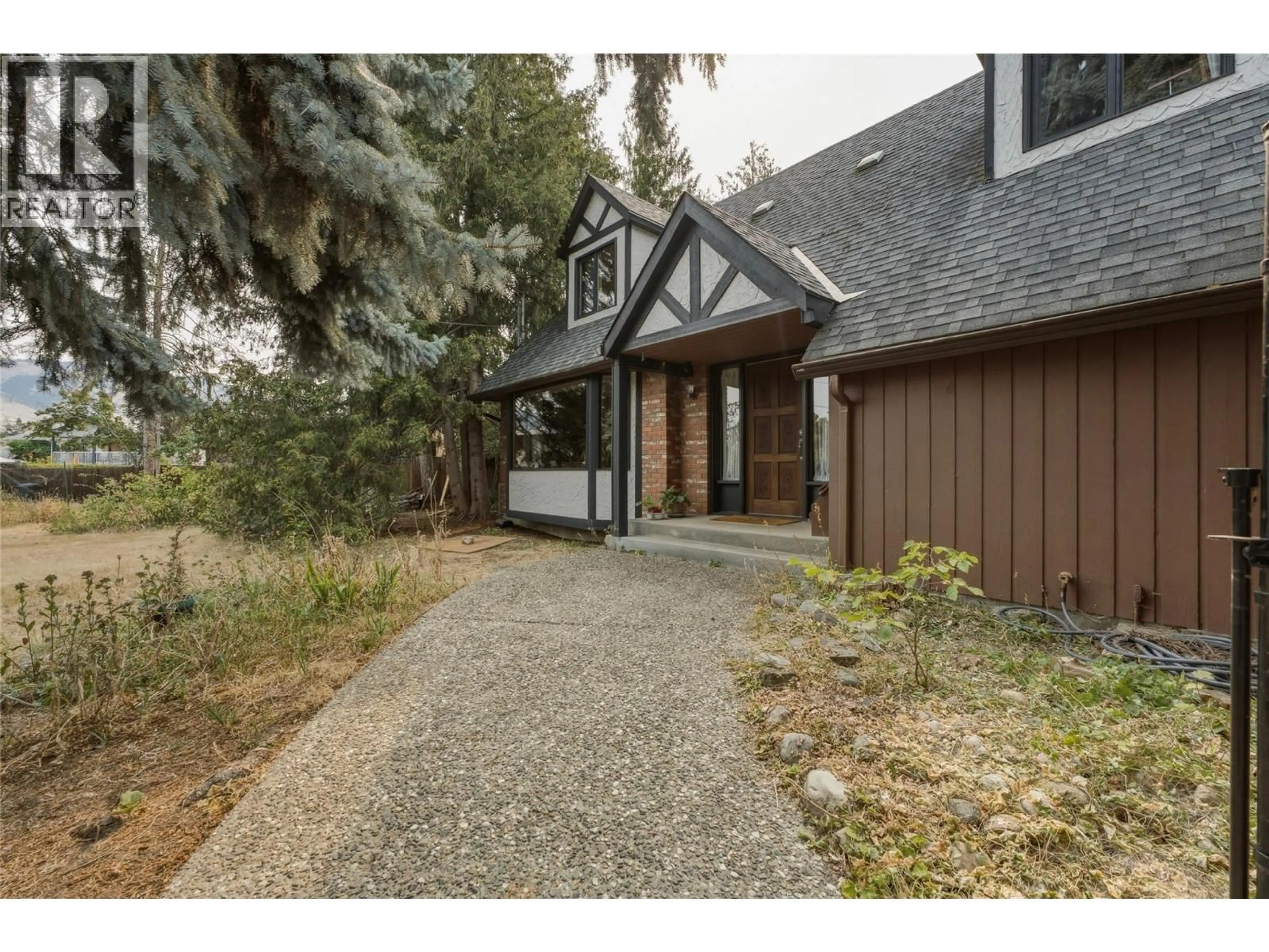 Home with brick exterior material, street for 7603 DE JONG DRIVE, Coldstream British Columbia V1B1P2