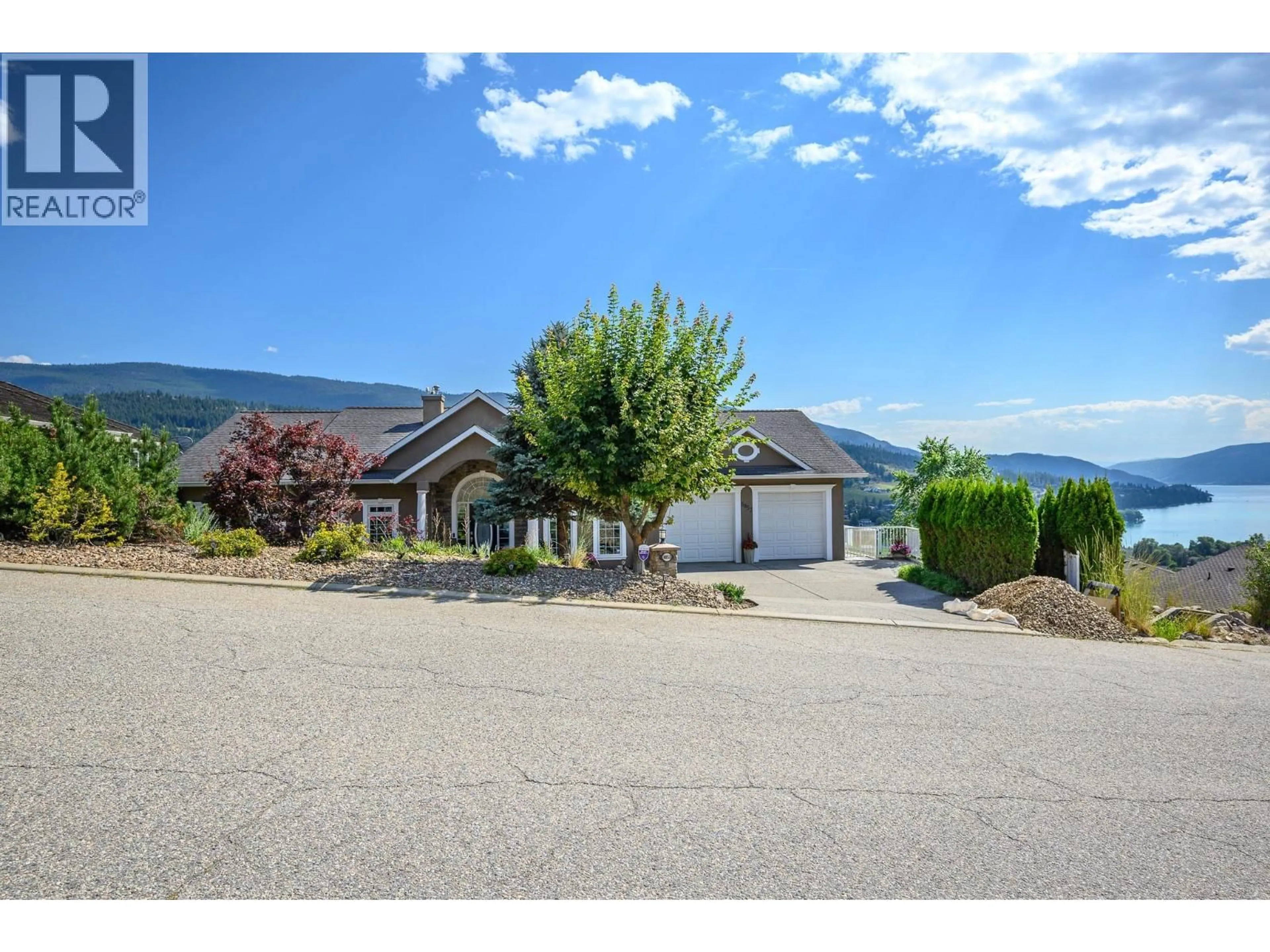 A pic from outside/outdoor area/front of a property/back of a property/a pic from drone, mountain view for 8853 BRAEBURN DRIVE, Coldstream British Columbia V1B3W8