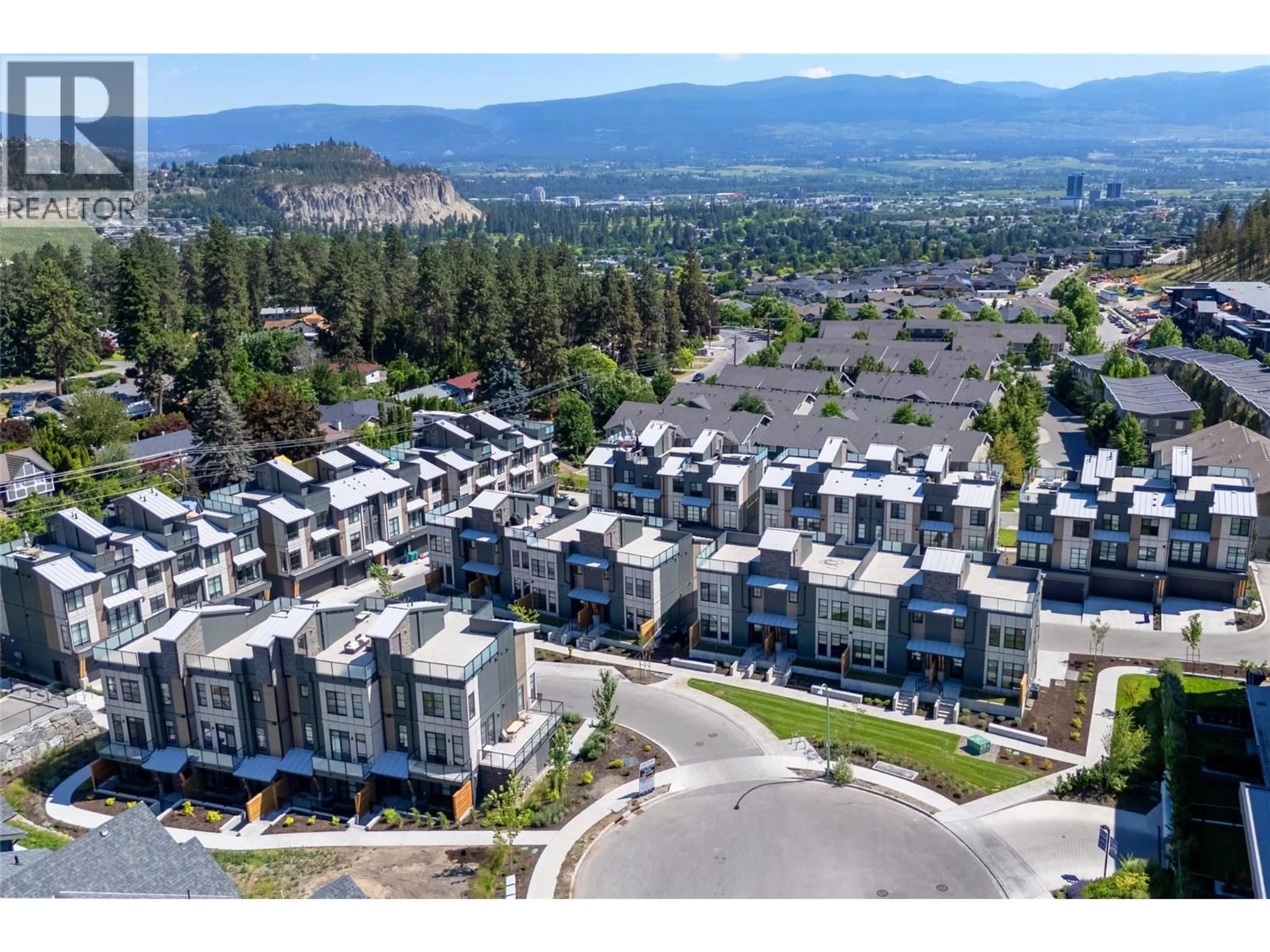 A pic from outside/outdoor area/front of a property/back of a property/a pic from drone, mountain view for 131 - 1455 CARA GLEN COURT, Kelowna British Columbia V1V3B8