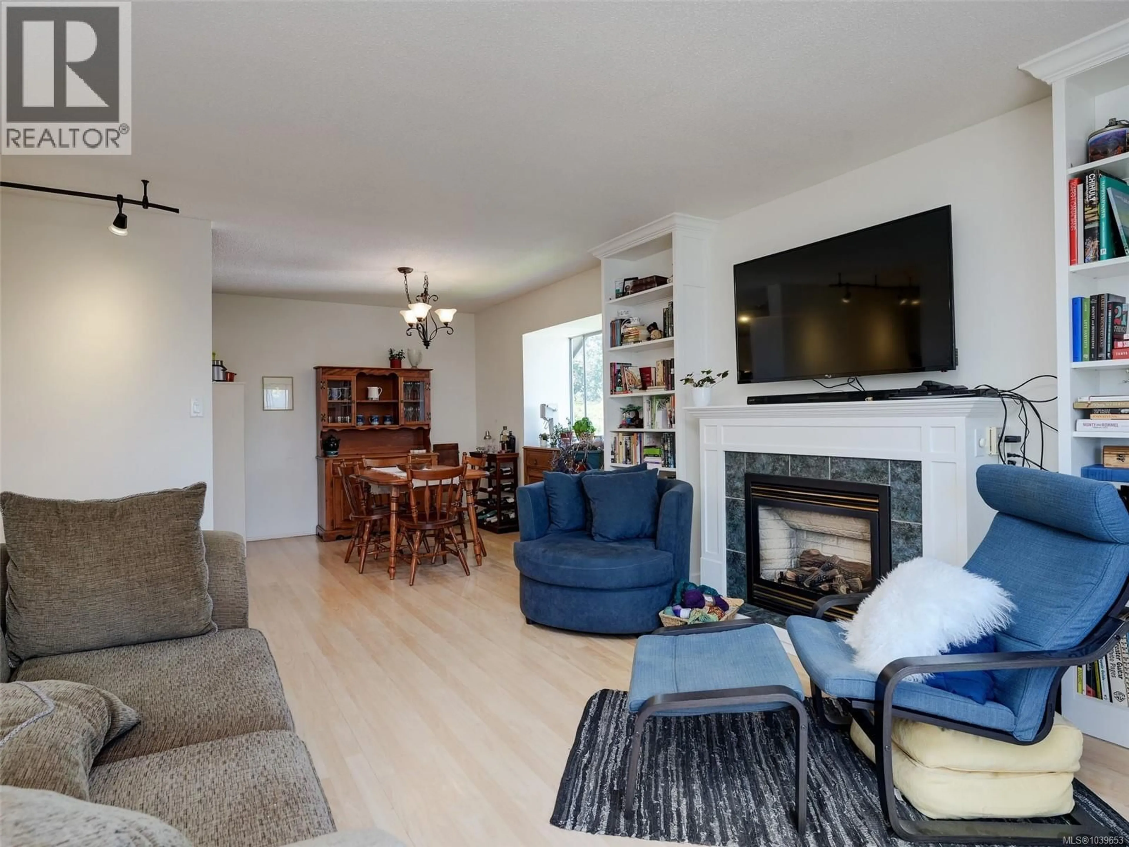 Living room with furniture, wood/laminate floor for 405 - 710 LAMPSON STREET, Esquimalt British Columbia V9A6A6